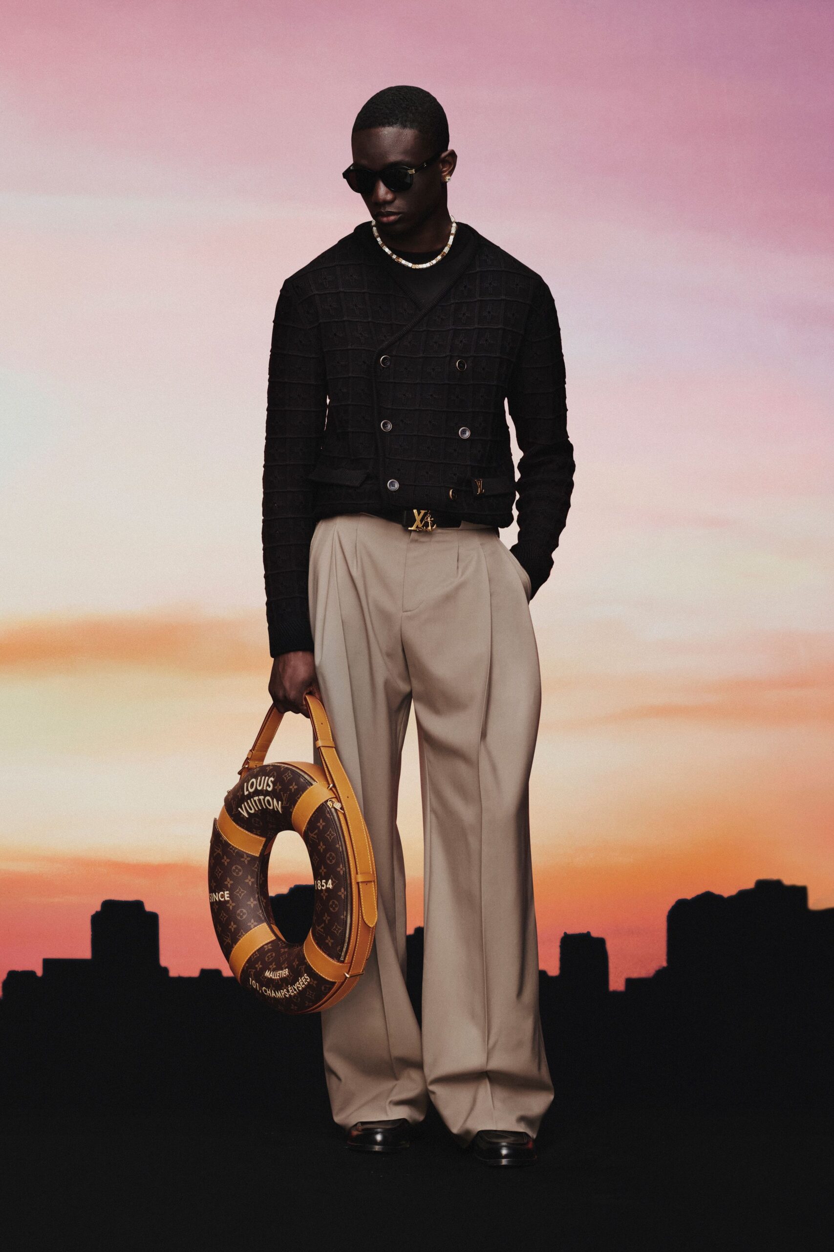 black fitted jacket with beige pants