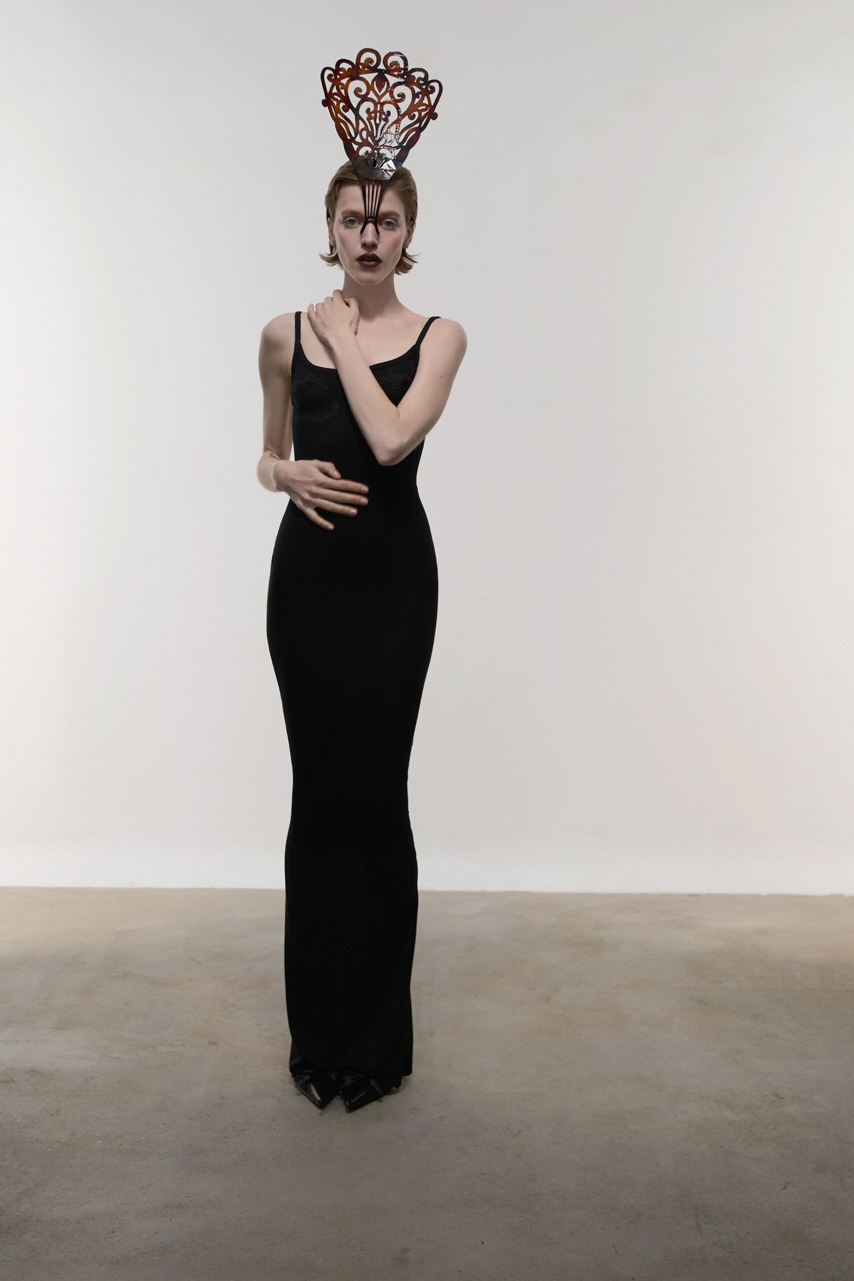 black fitted silk gown with hat