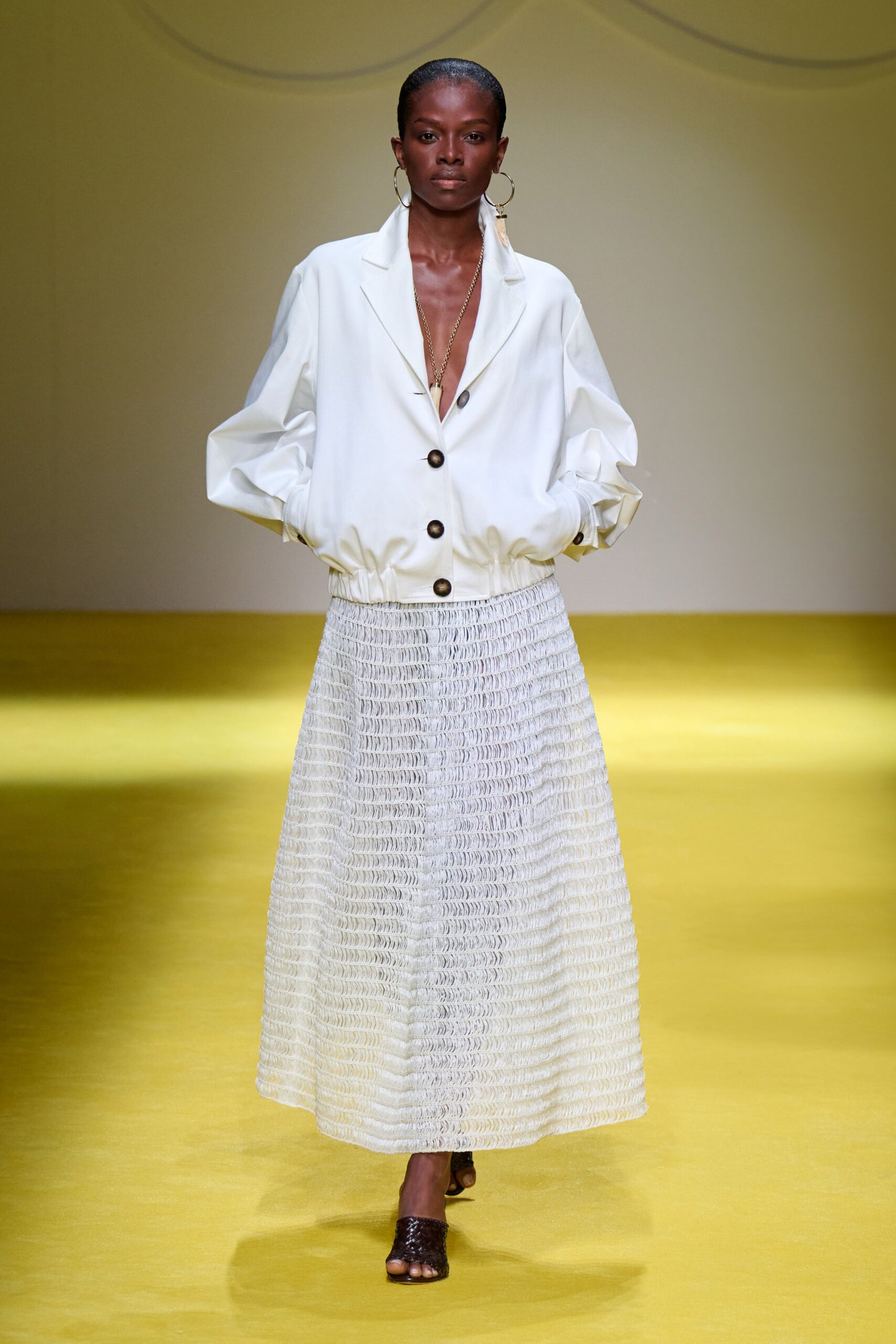white relaxed jacket with pleated skirt