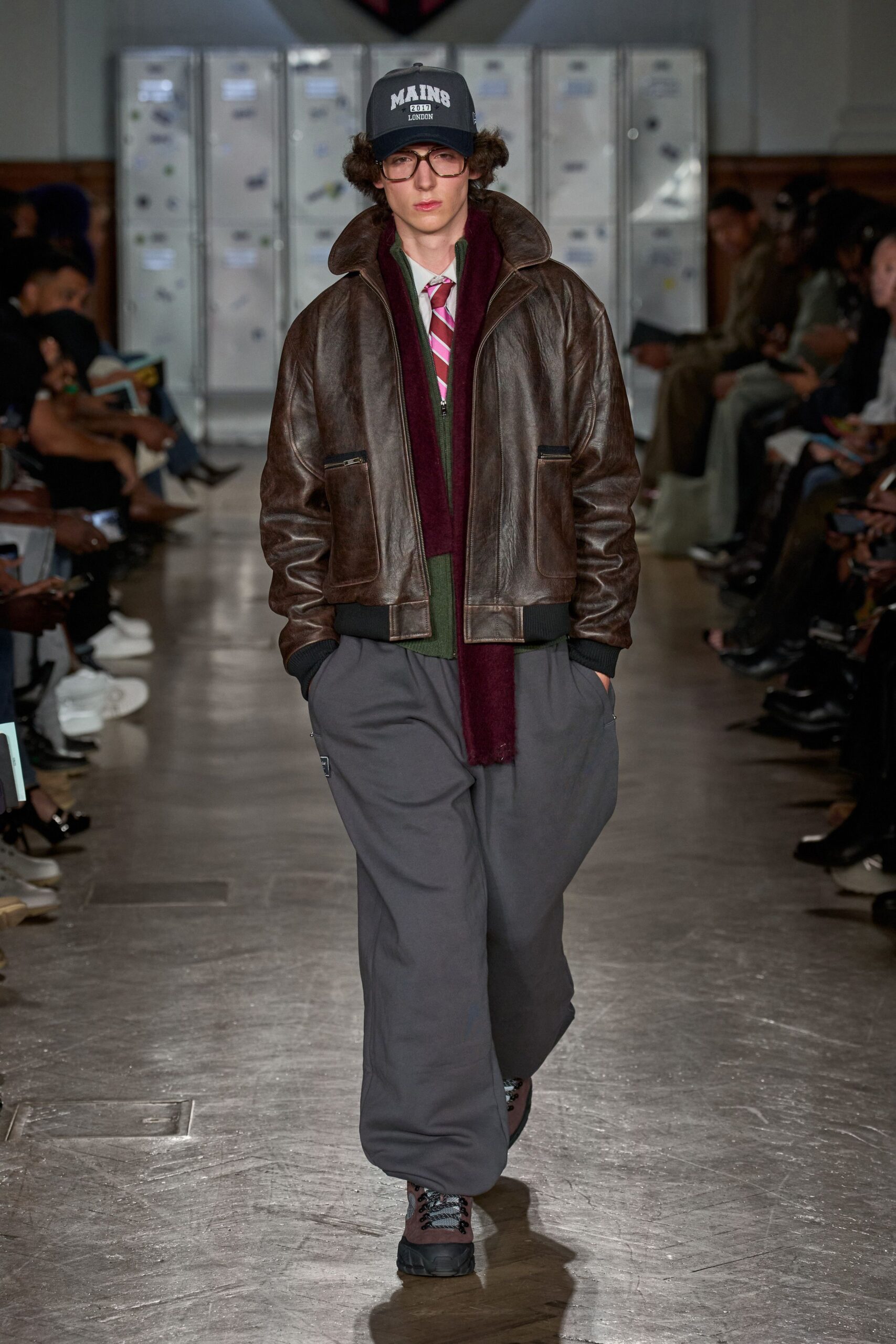 brown leather jacket with gray pants