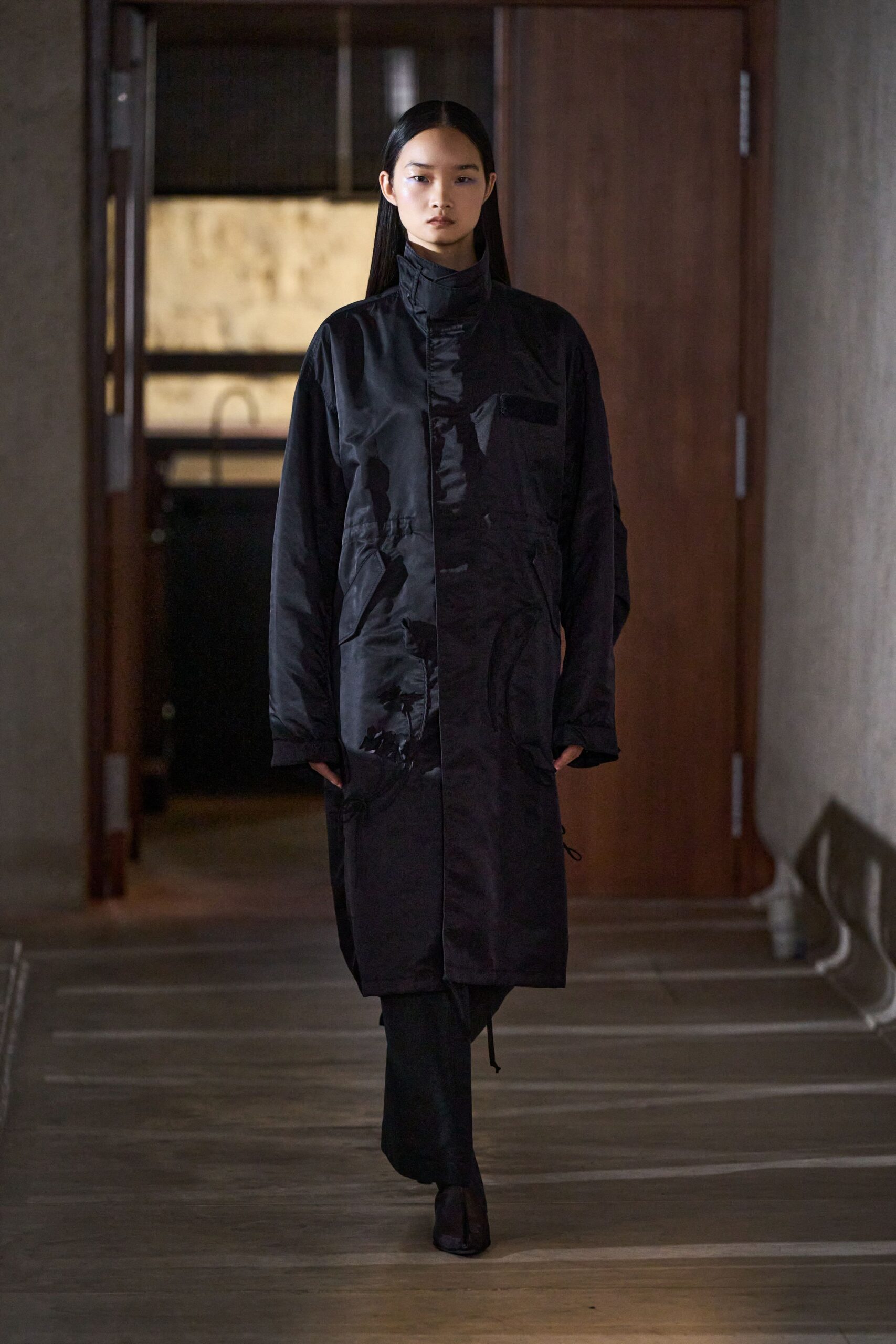 black relaxed coat with fitted pants