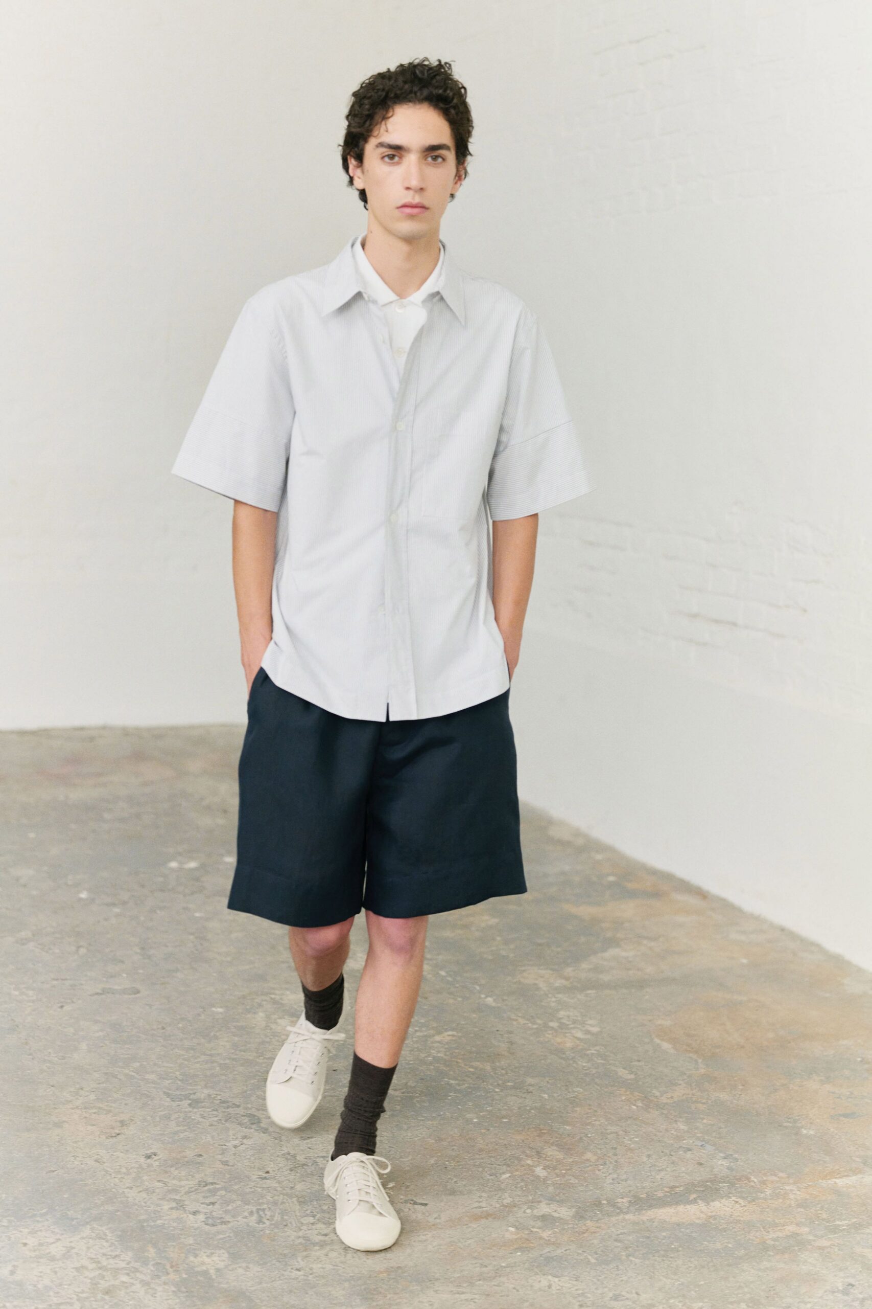 relaxed white shirt and navy shorts