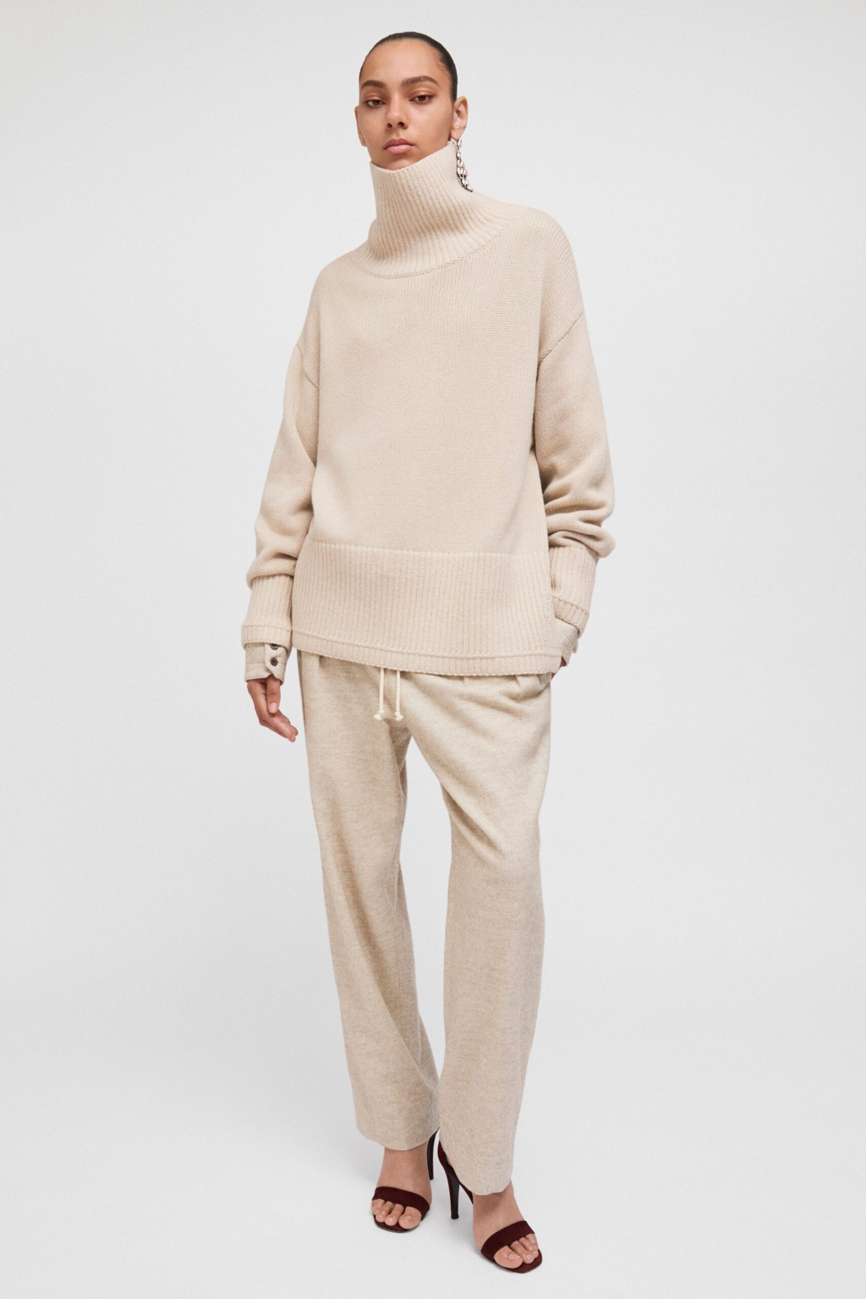 beige oversized sweater and relaxed pants