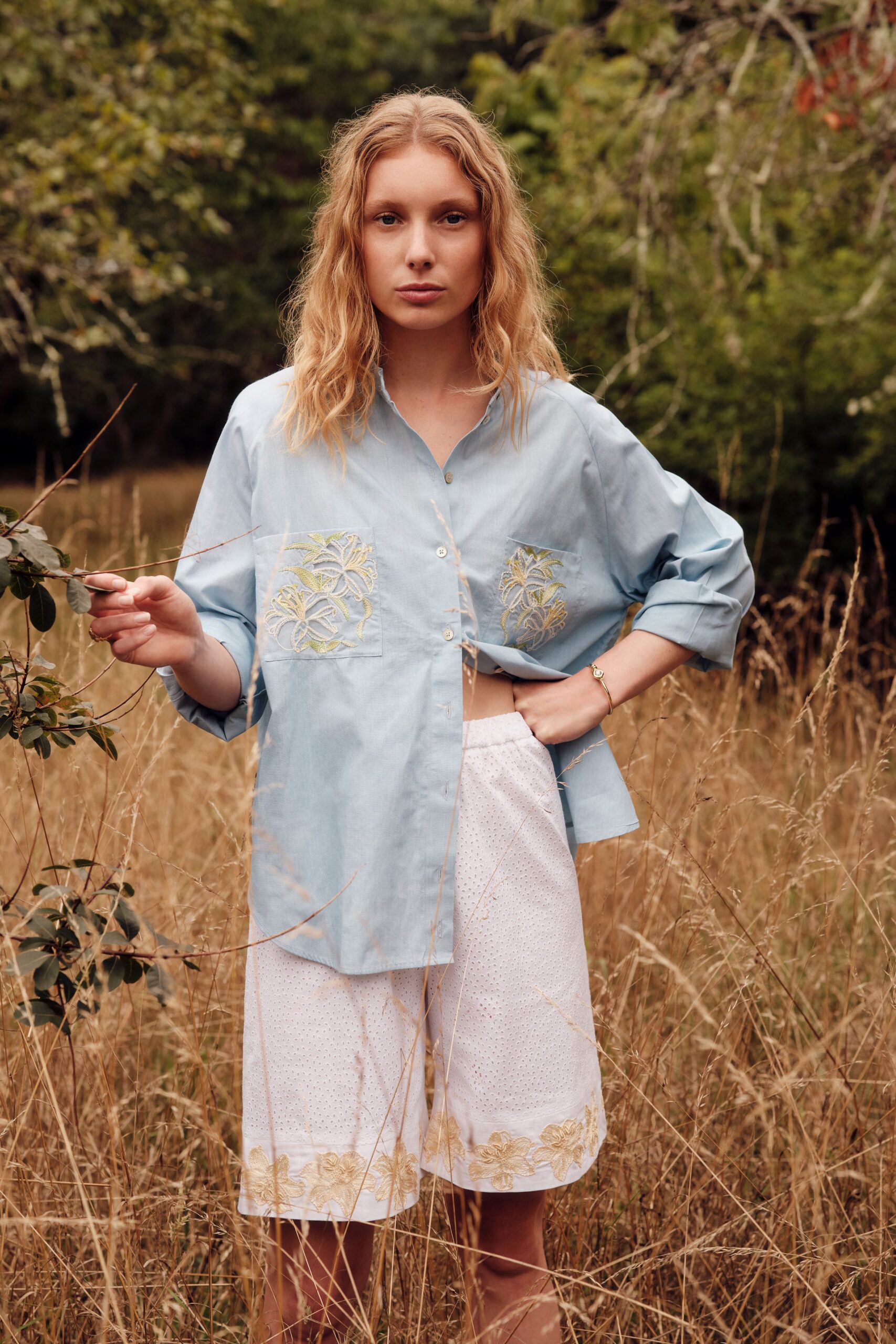 blue relaxed shirt with white shorts
