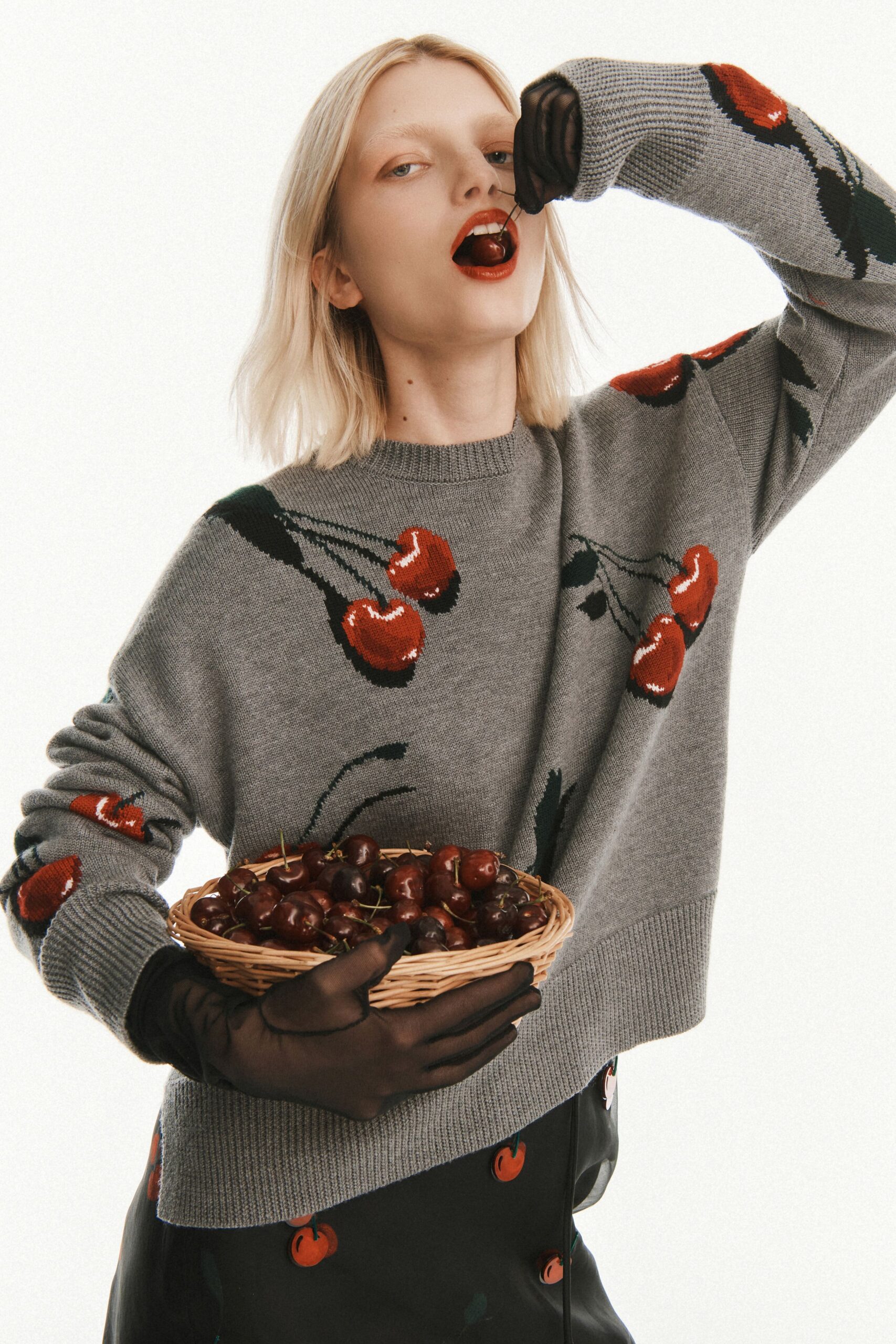 gray embroidered sweater with black skirt