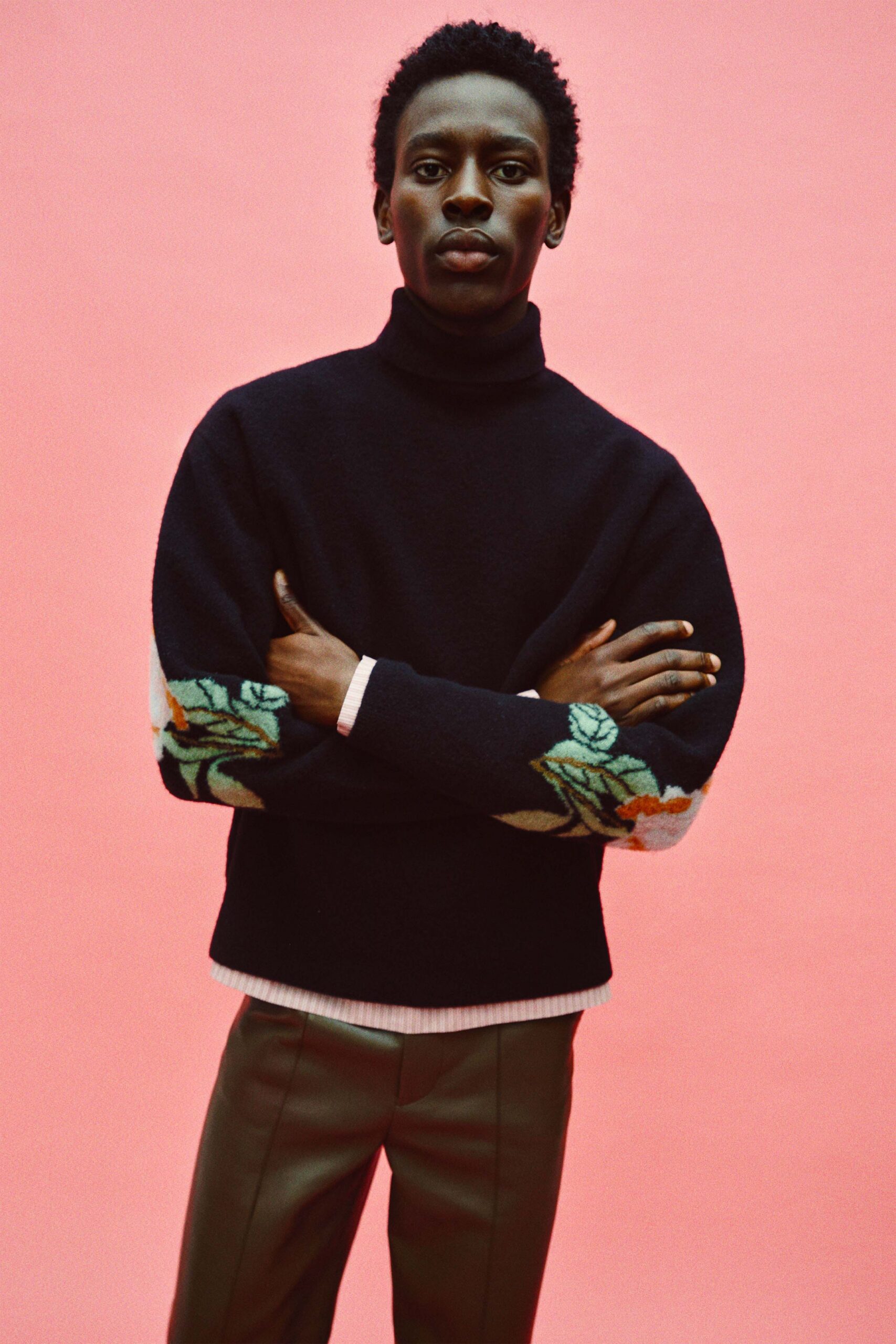 black wool relaxed sweater with embroidered details