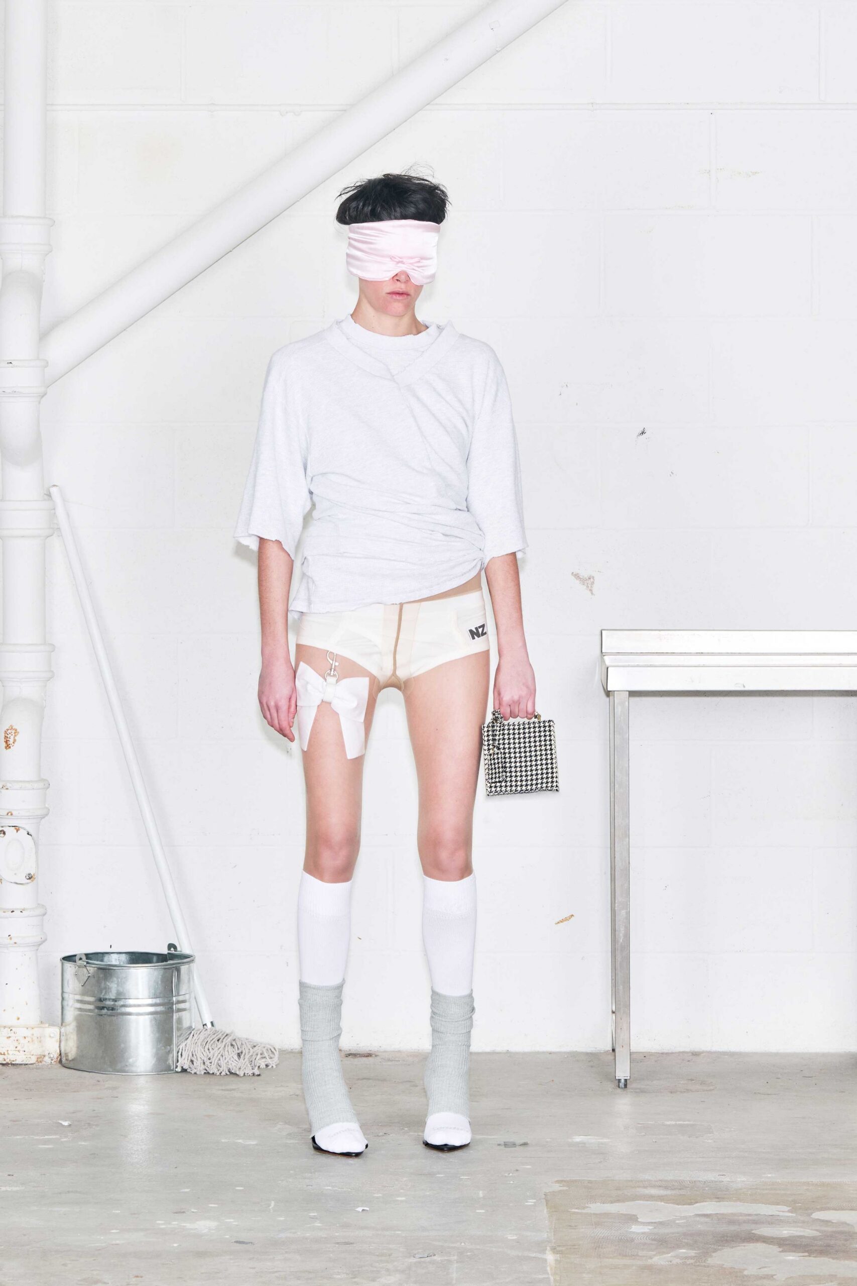 gray relaxed top with beige shorts