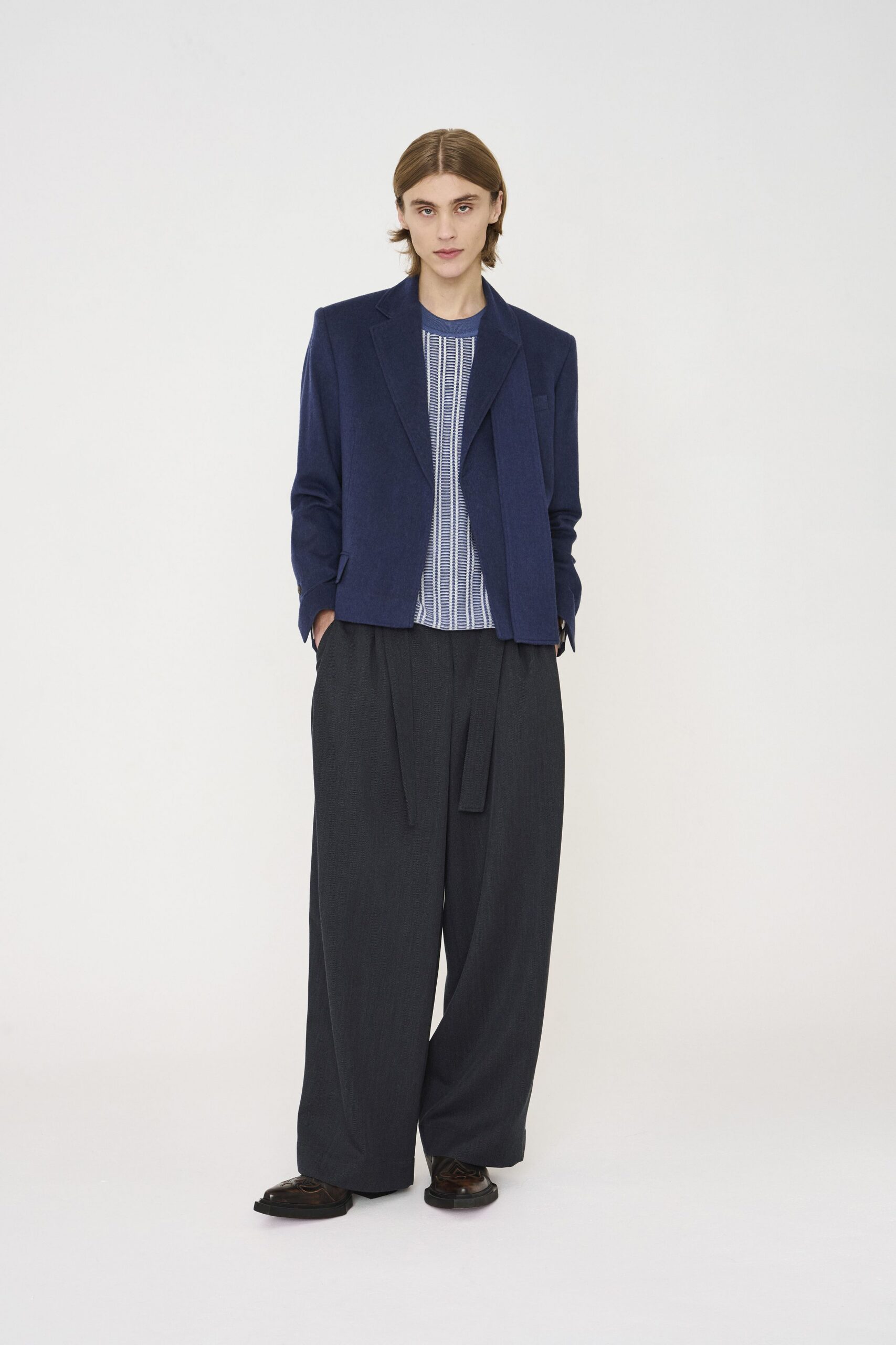 blue blazer with relaxed shirt and gray pants
