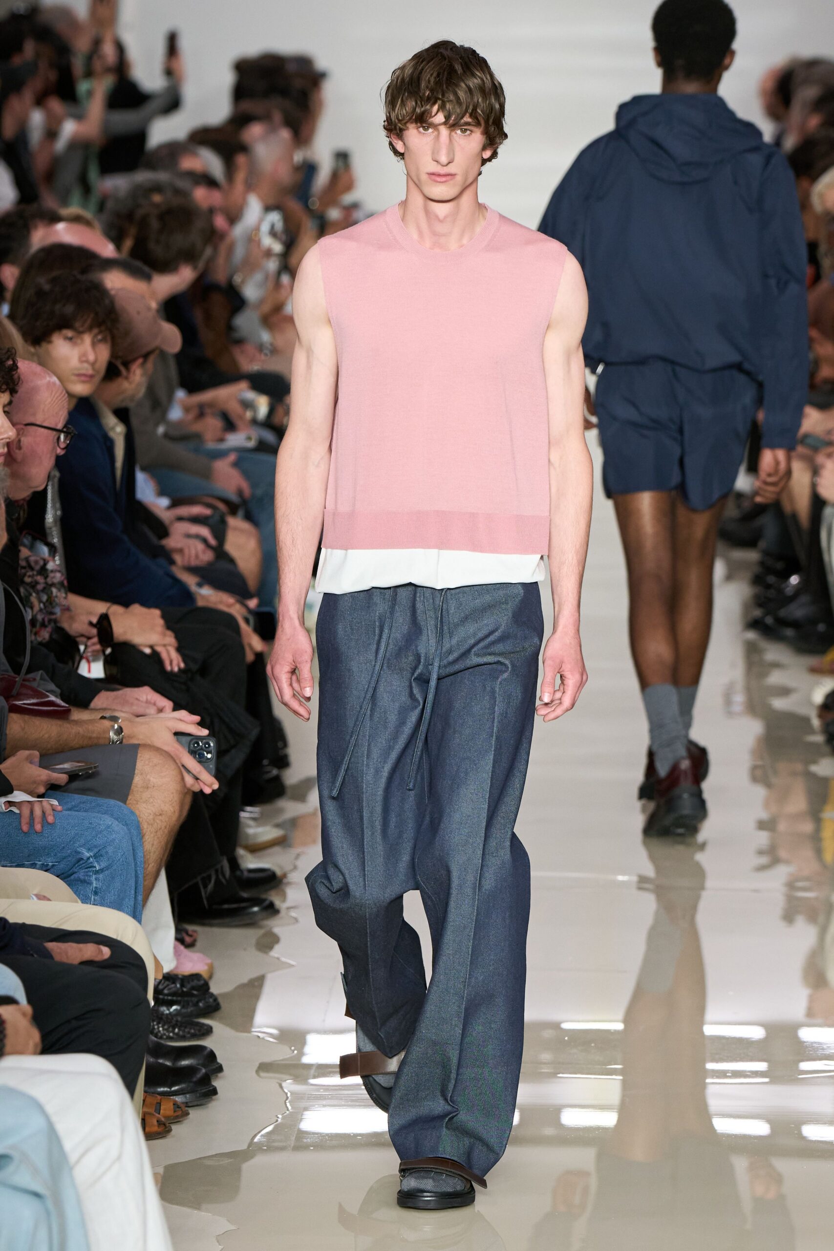 pink sleeveless top with blue pants