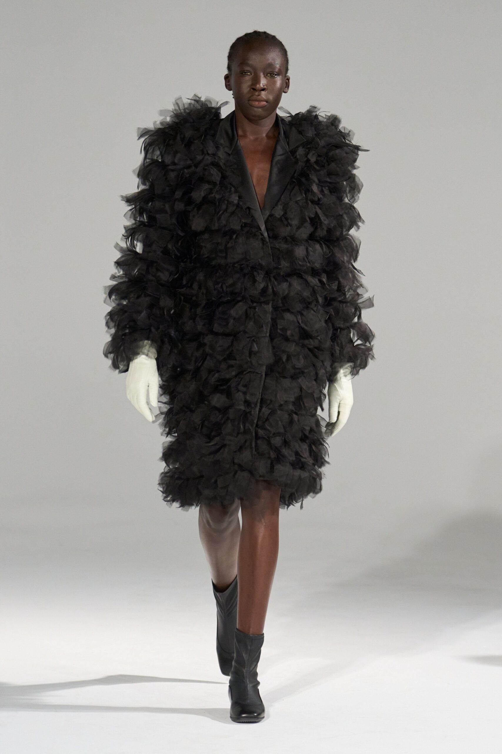 black ruffled coat with gloves
