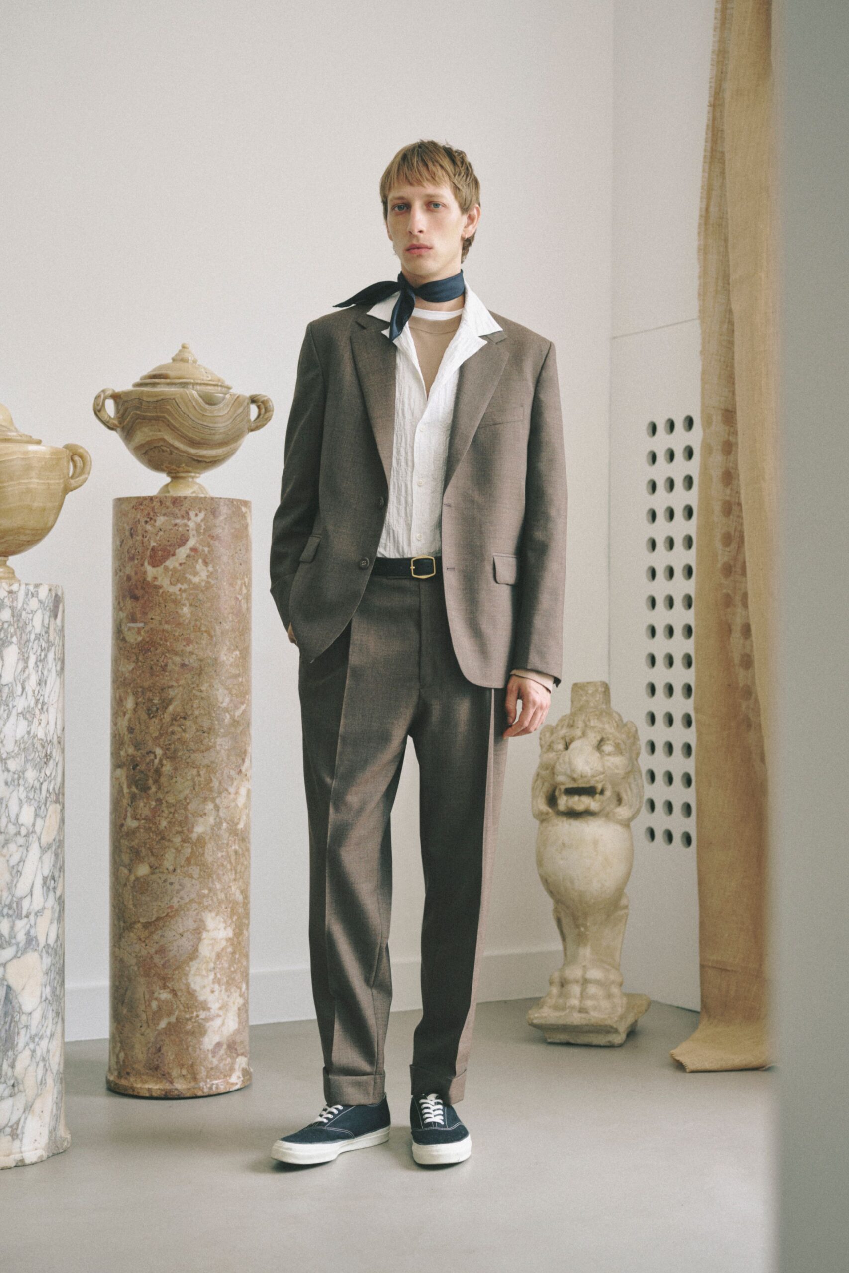 brown tailored suit with beige turtleneck
