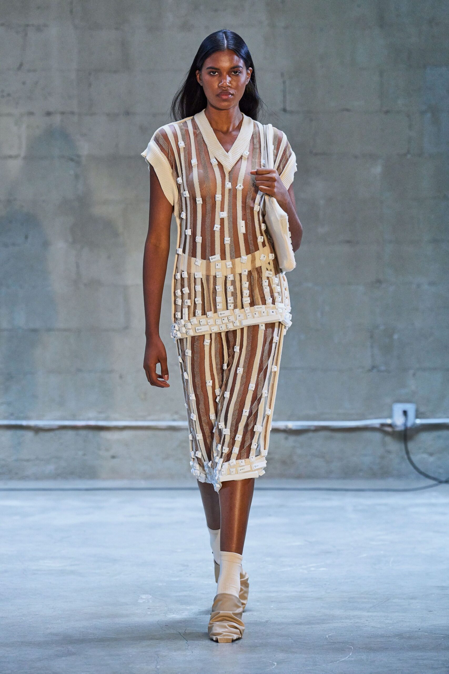 beige cotton sleeveless v-neck fitted pleated layered dress