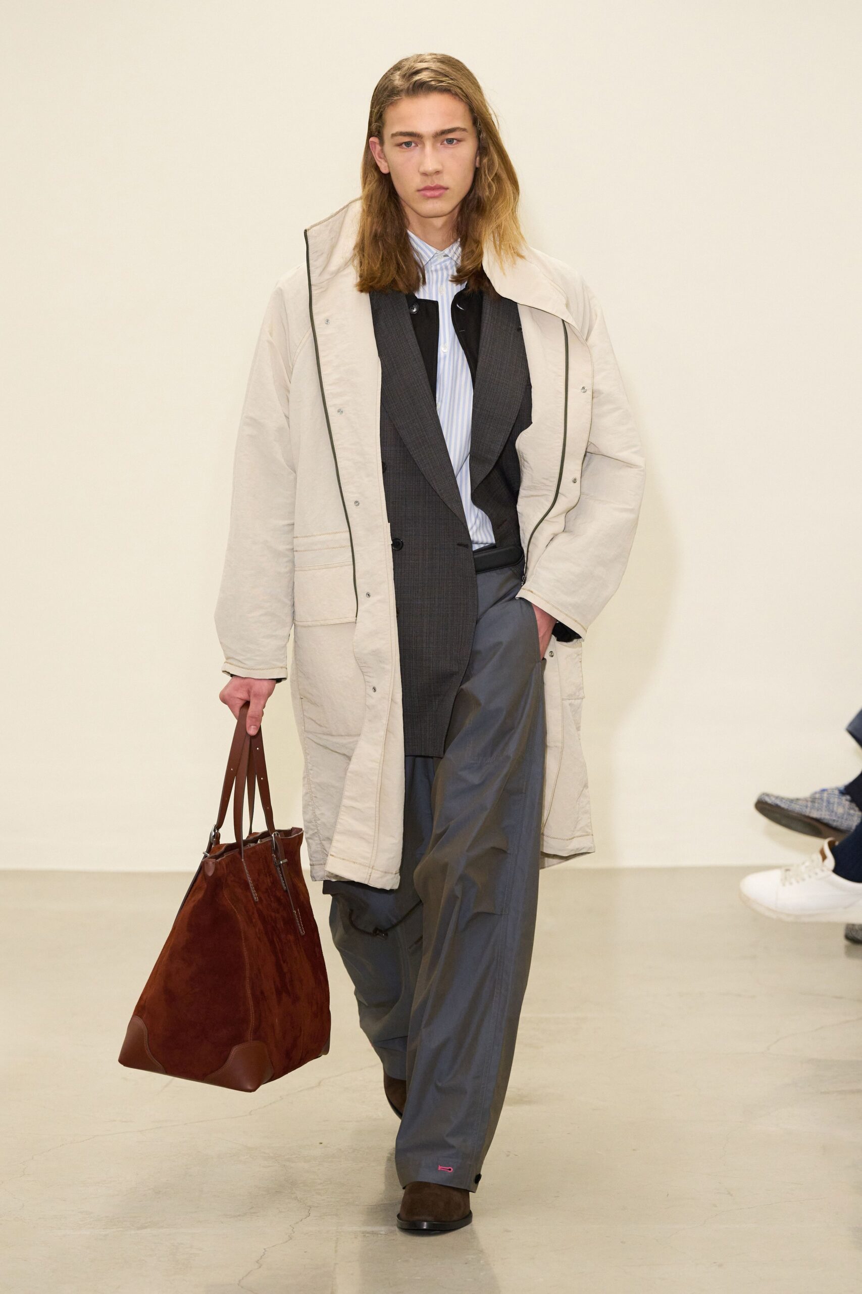 beige coat gray suit blue shirt