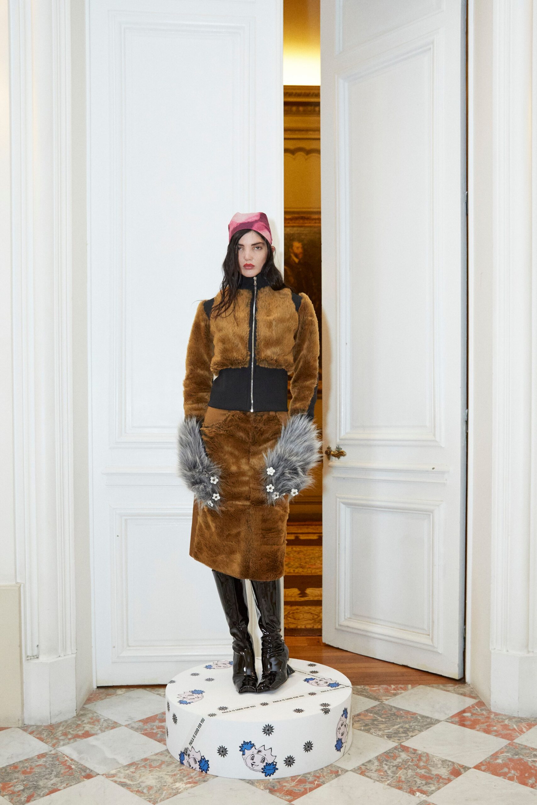 brown faux-fur coat and black skirt