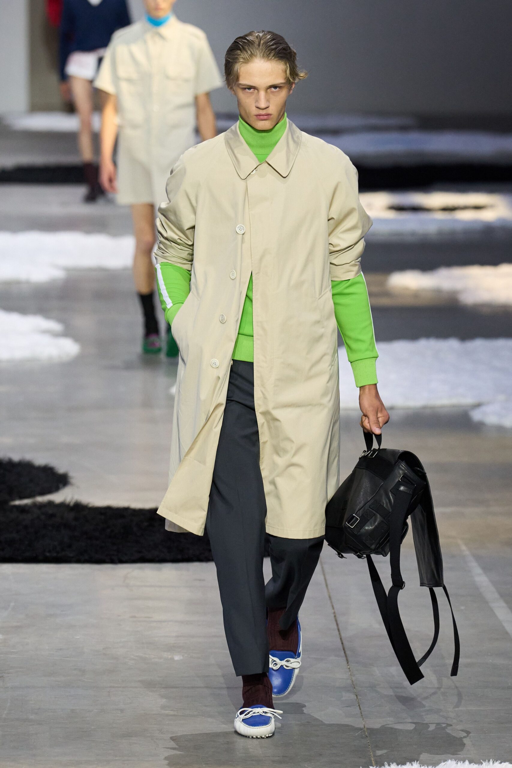 beige coat green top gray pants