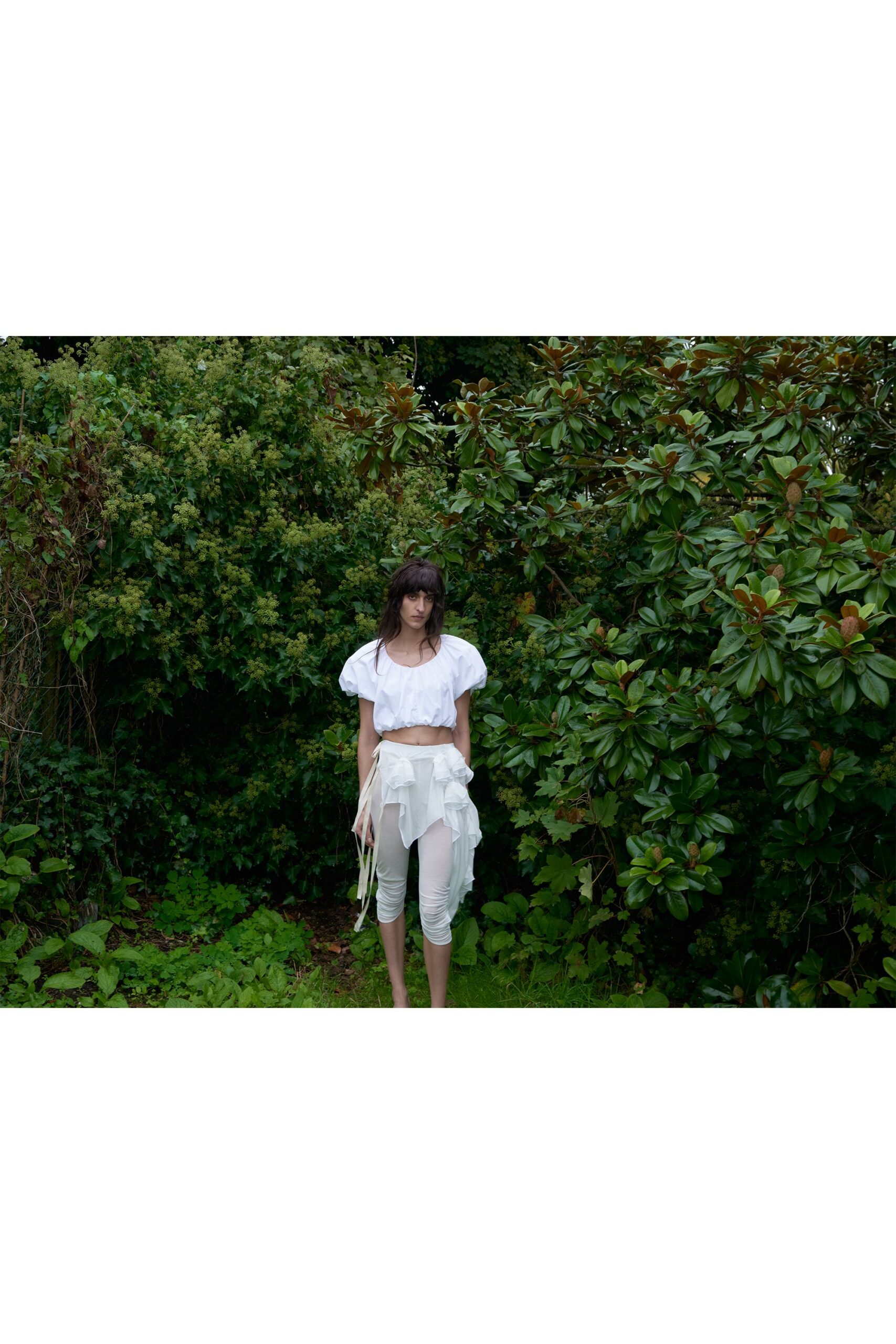 white relaxed top and fitted pants