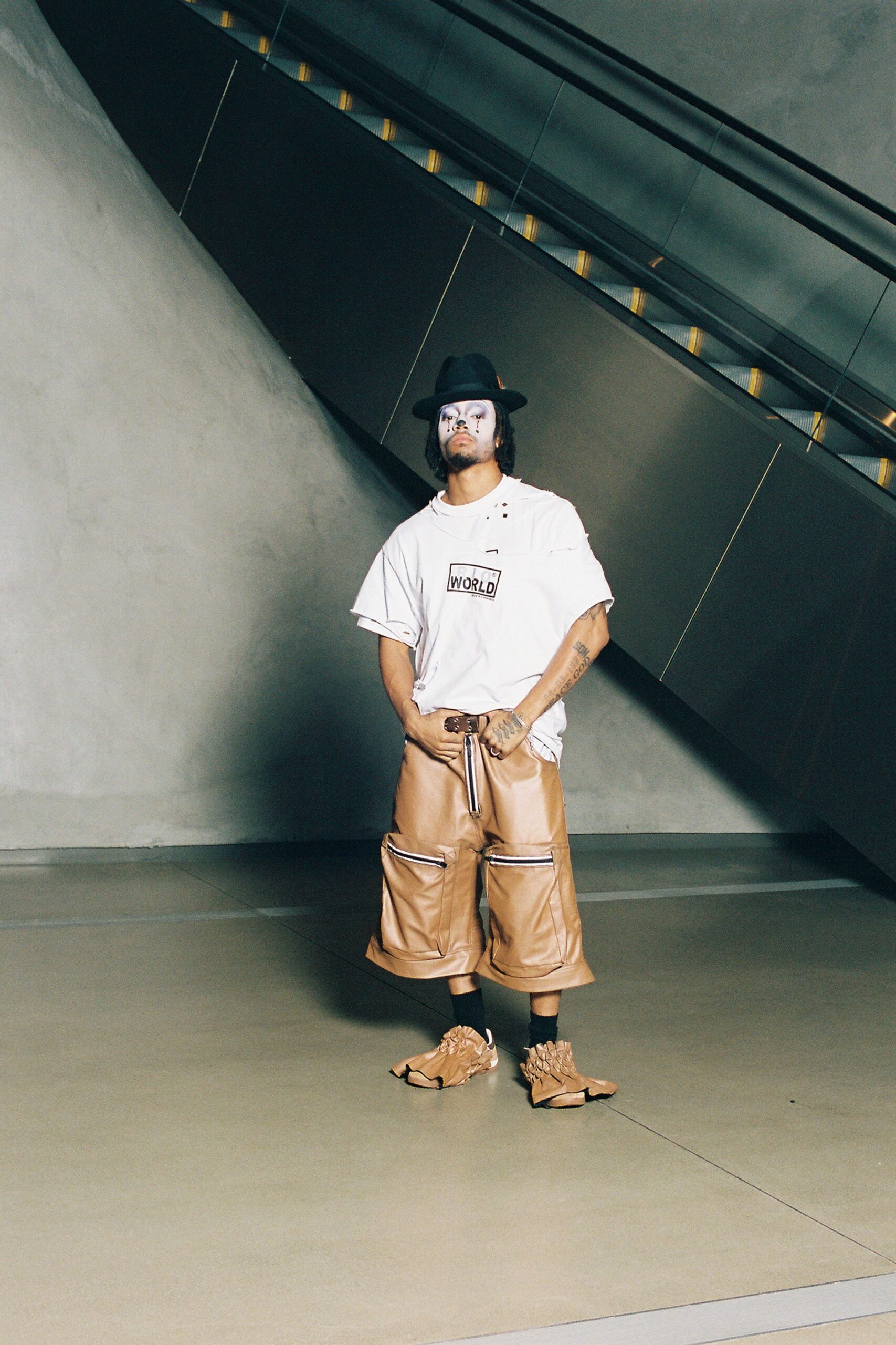 white t-shirt brown leather pants