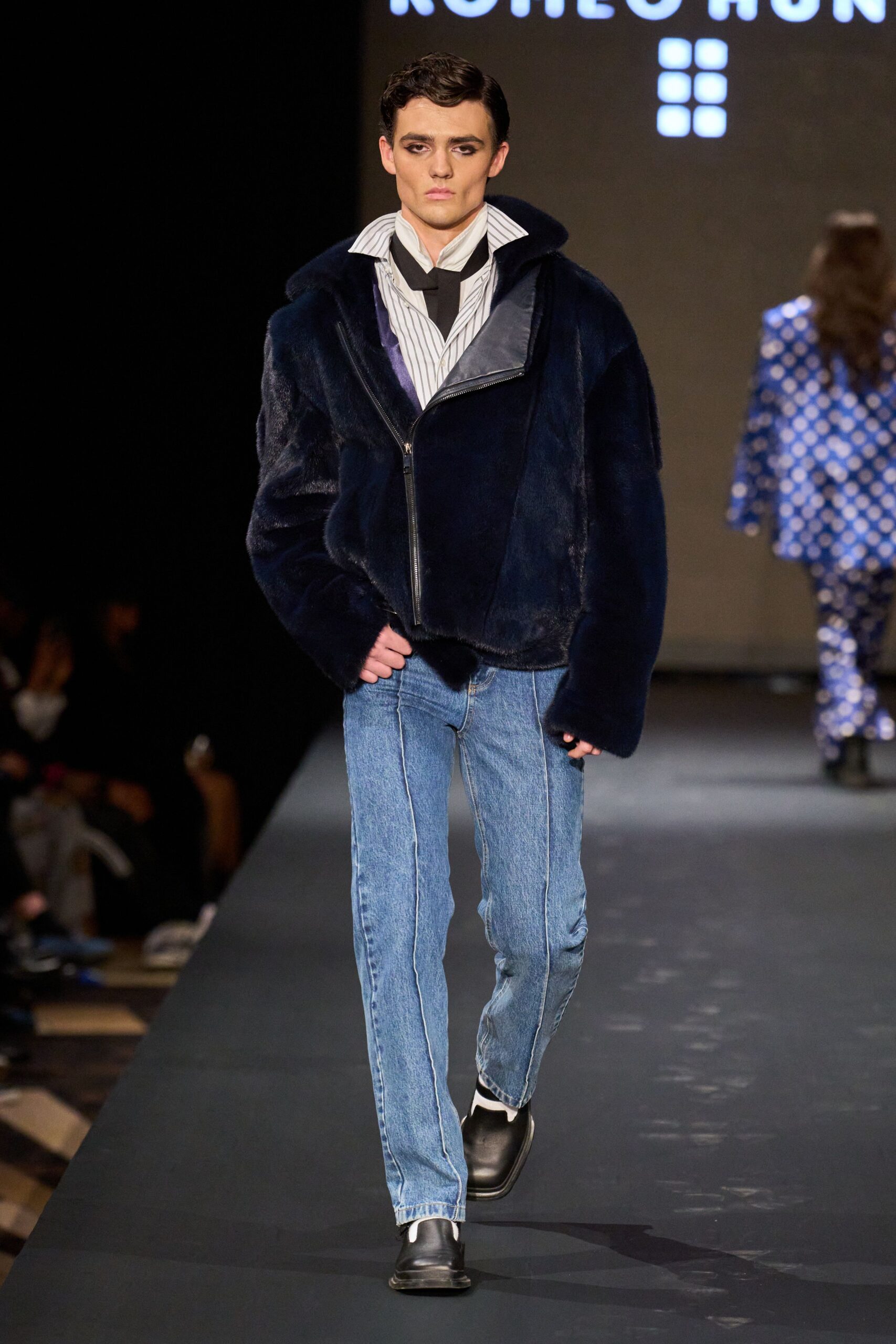 blue faux-fur jacket with striped shirt