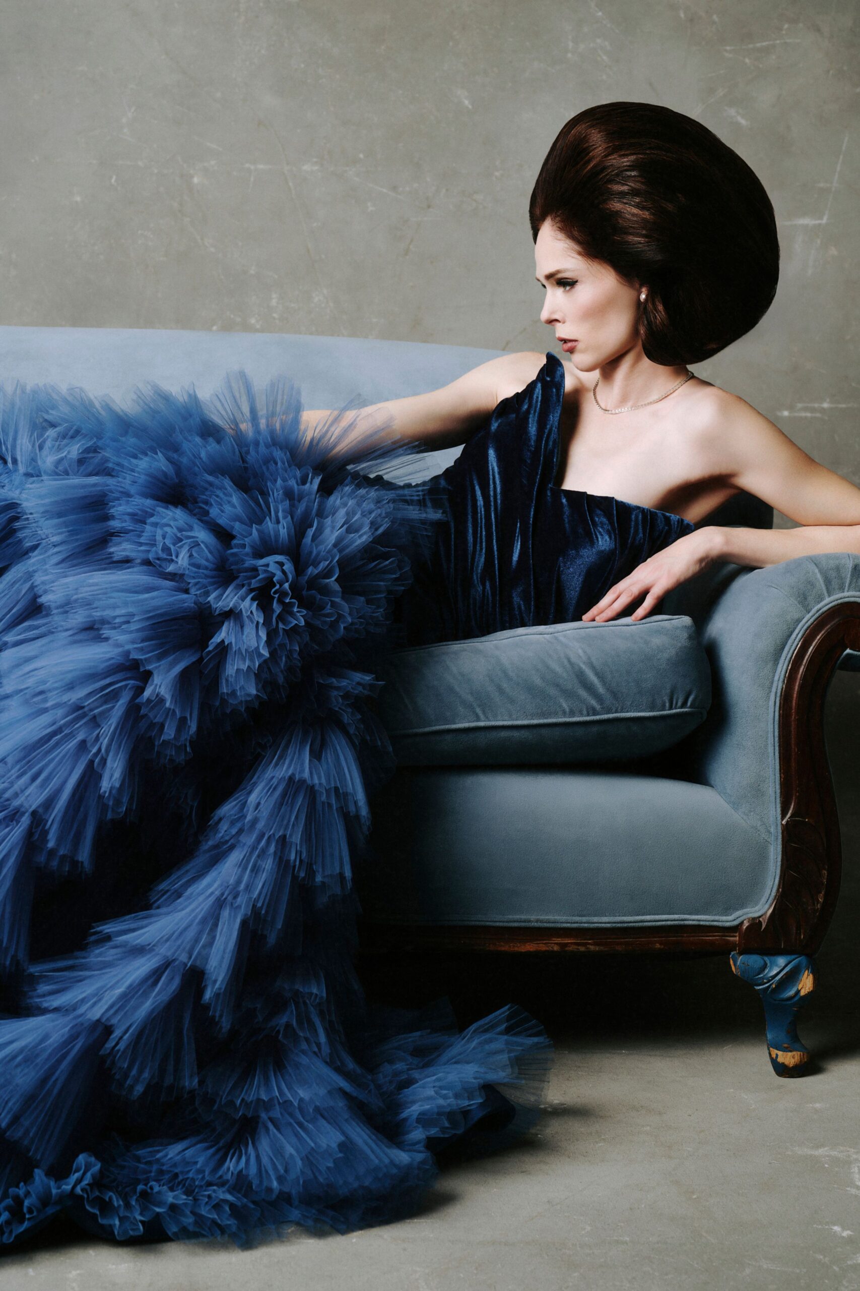 blue tulle sleeveless off-shoulder fitted ruffled flowing gown