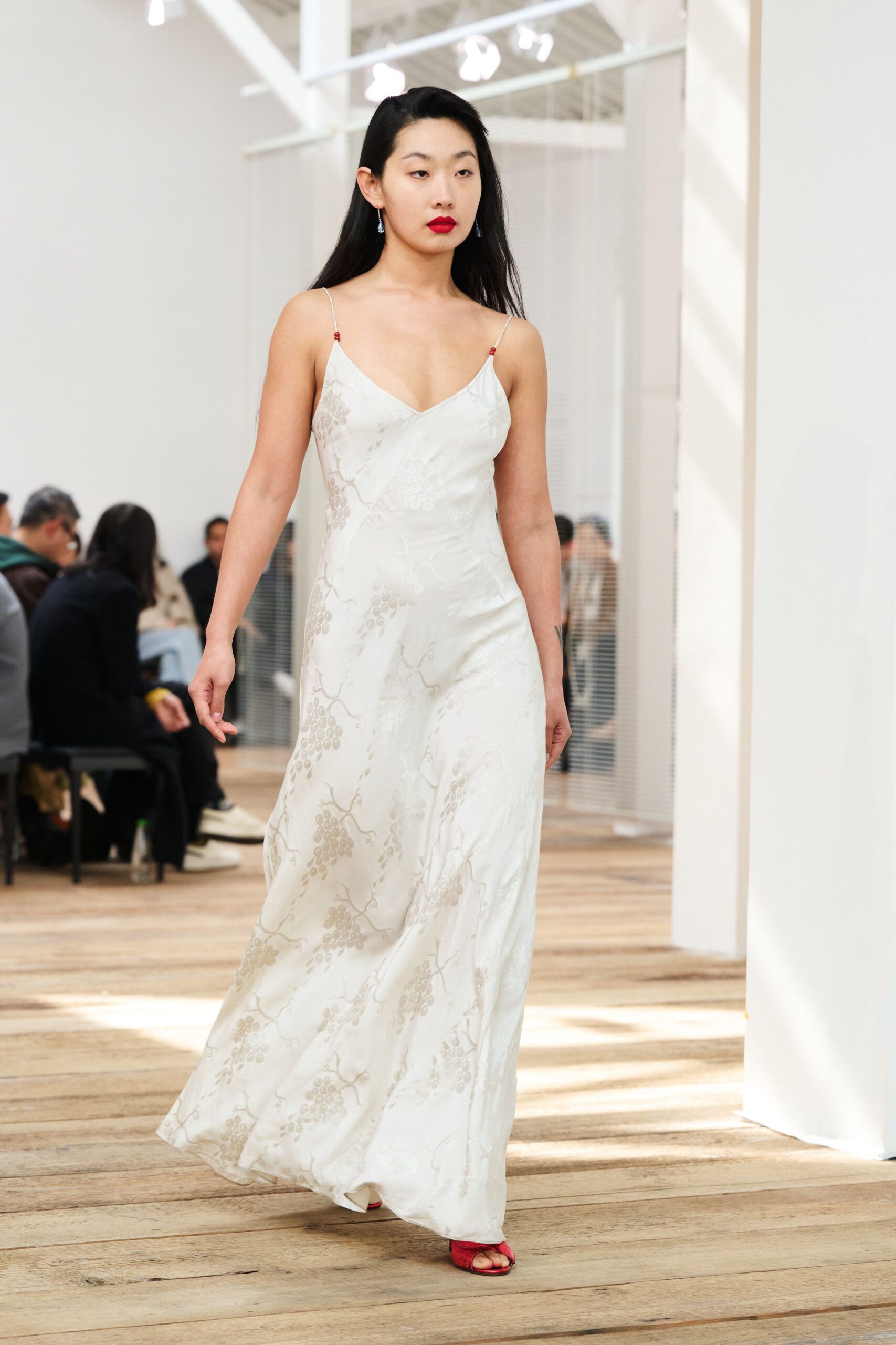 white silk embroidered gown with red shoes