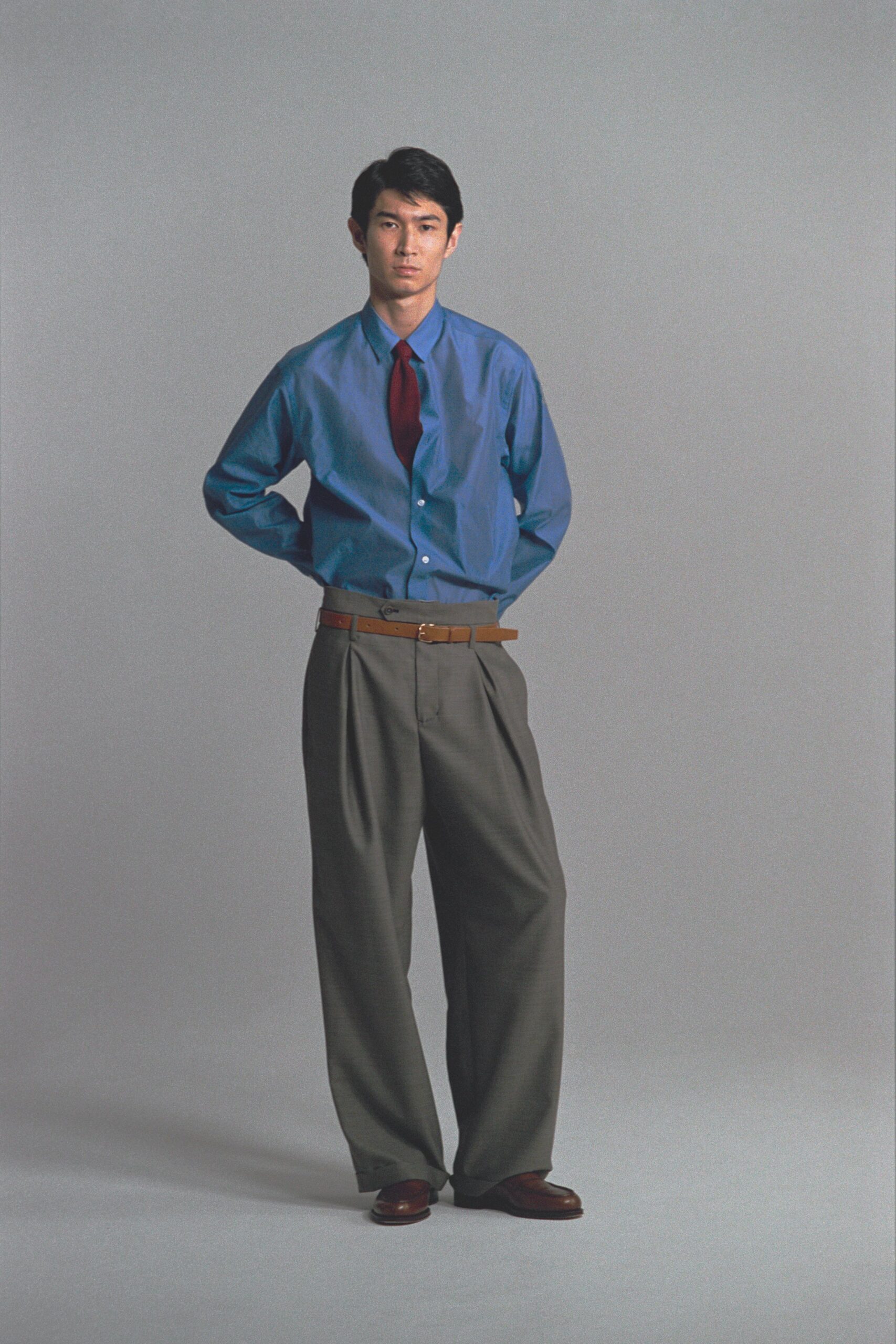 blue shirt gray pants outfit
