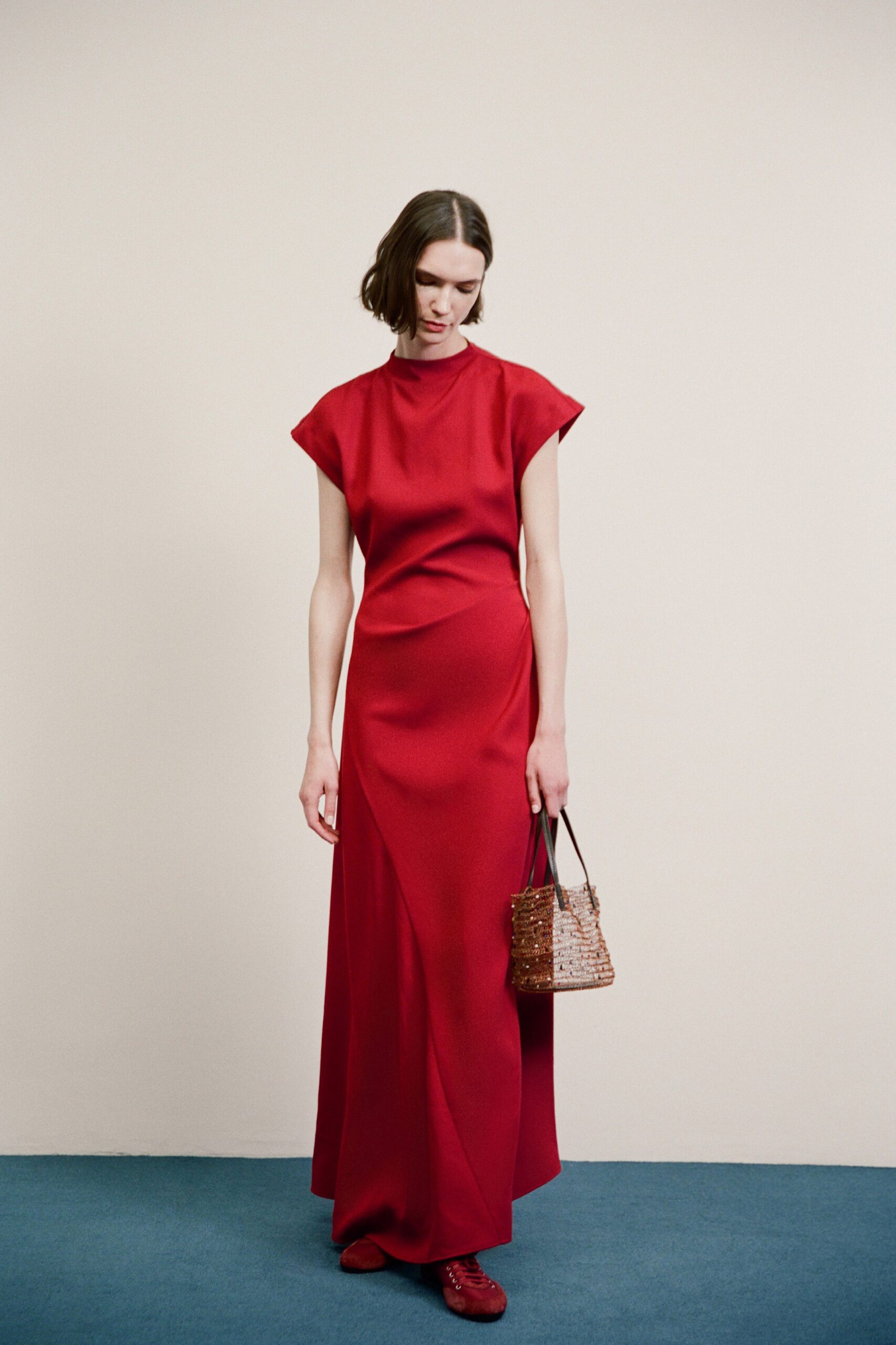 red silk short-sleeve high-neck fitted draped maxi gown