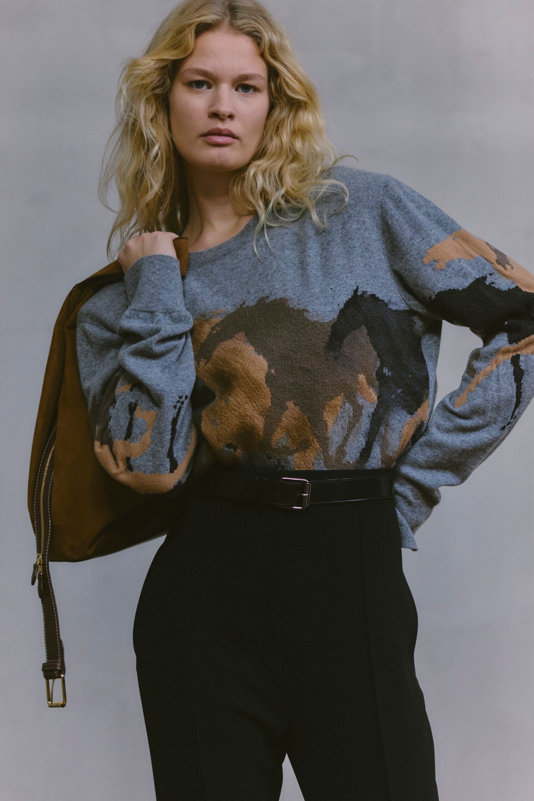 gray printed sweater with black pants