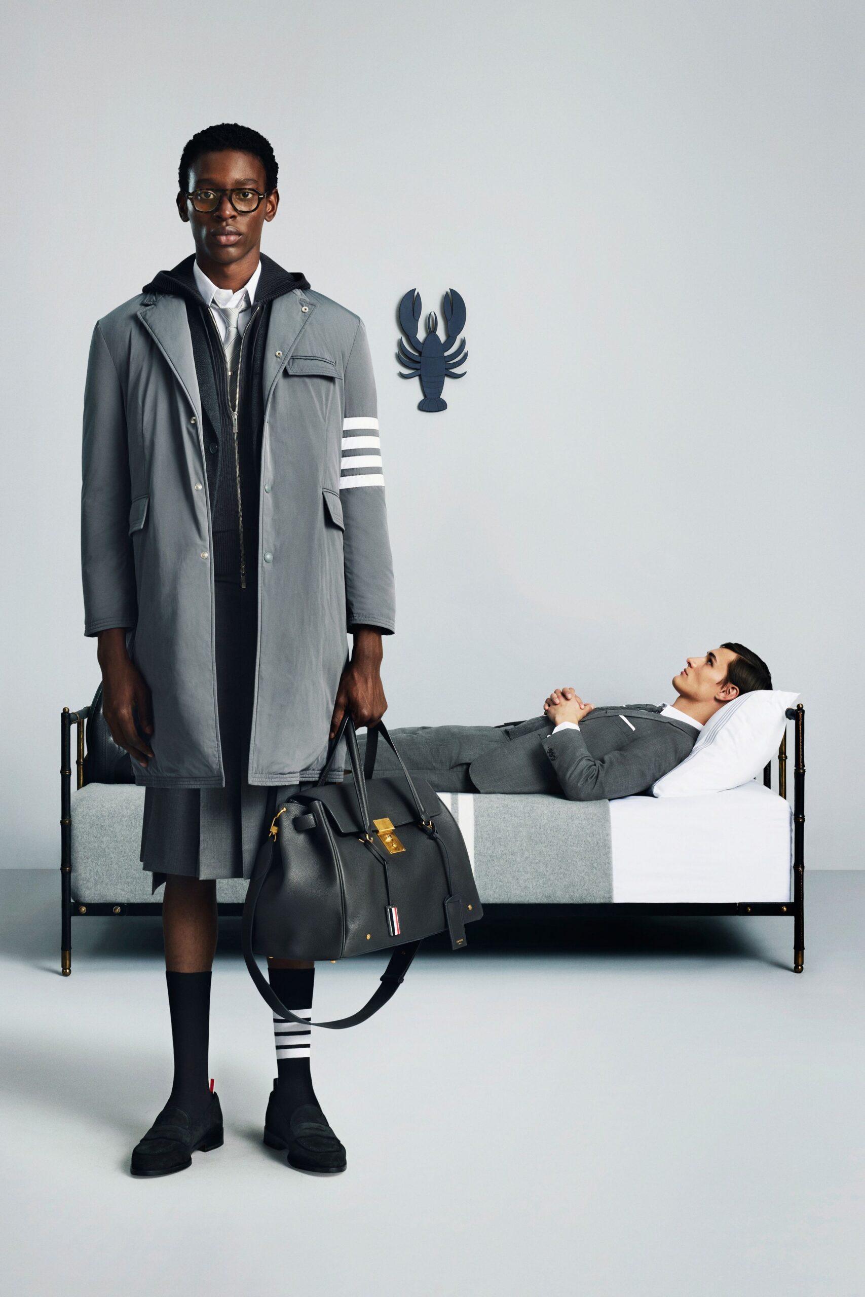 gray coat and suit with black shoes