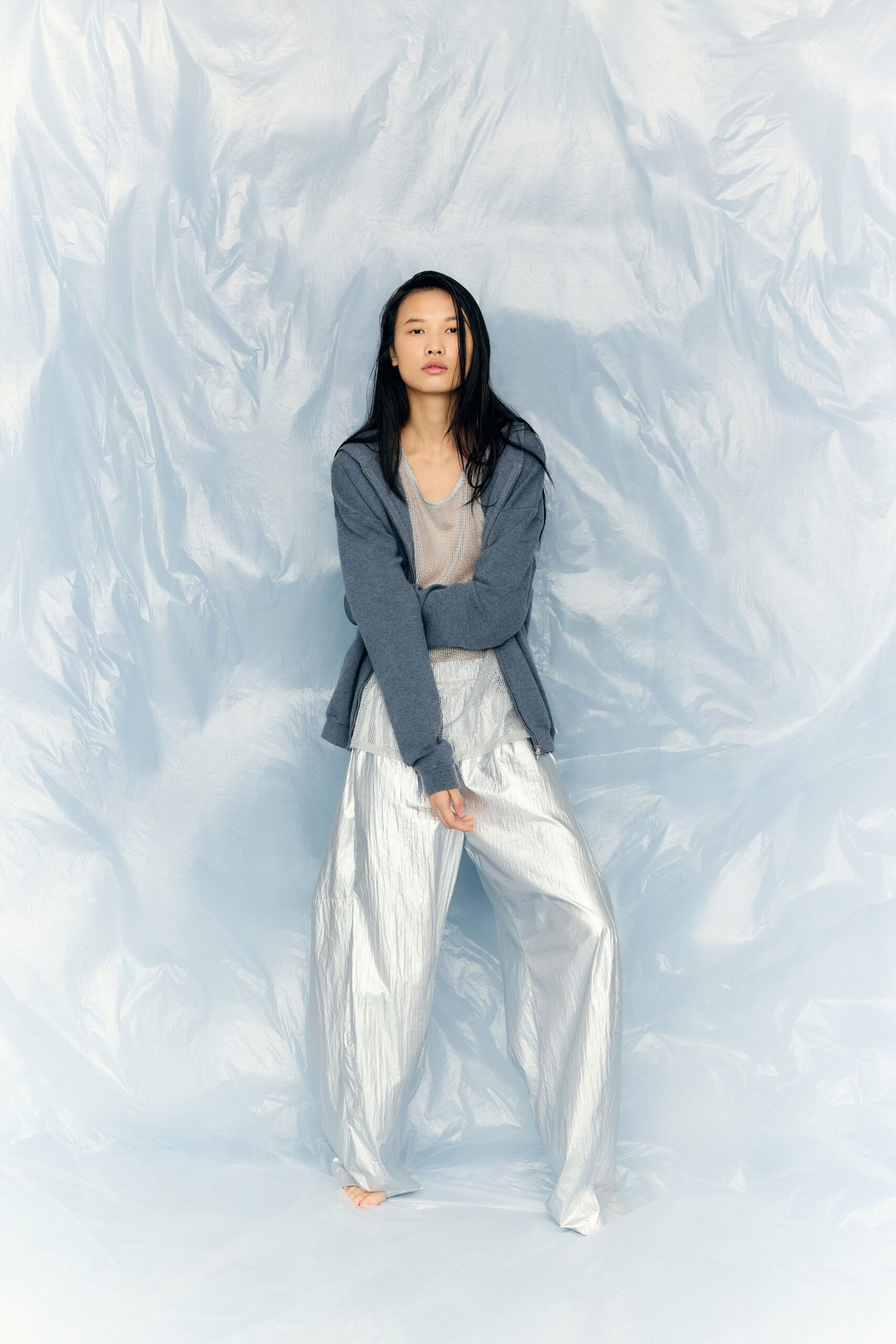 gray jacket white top silver pants