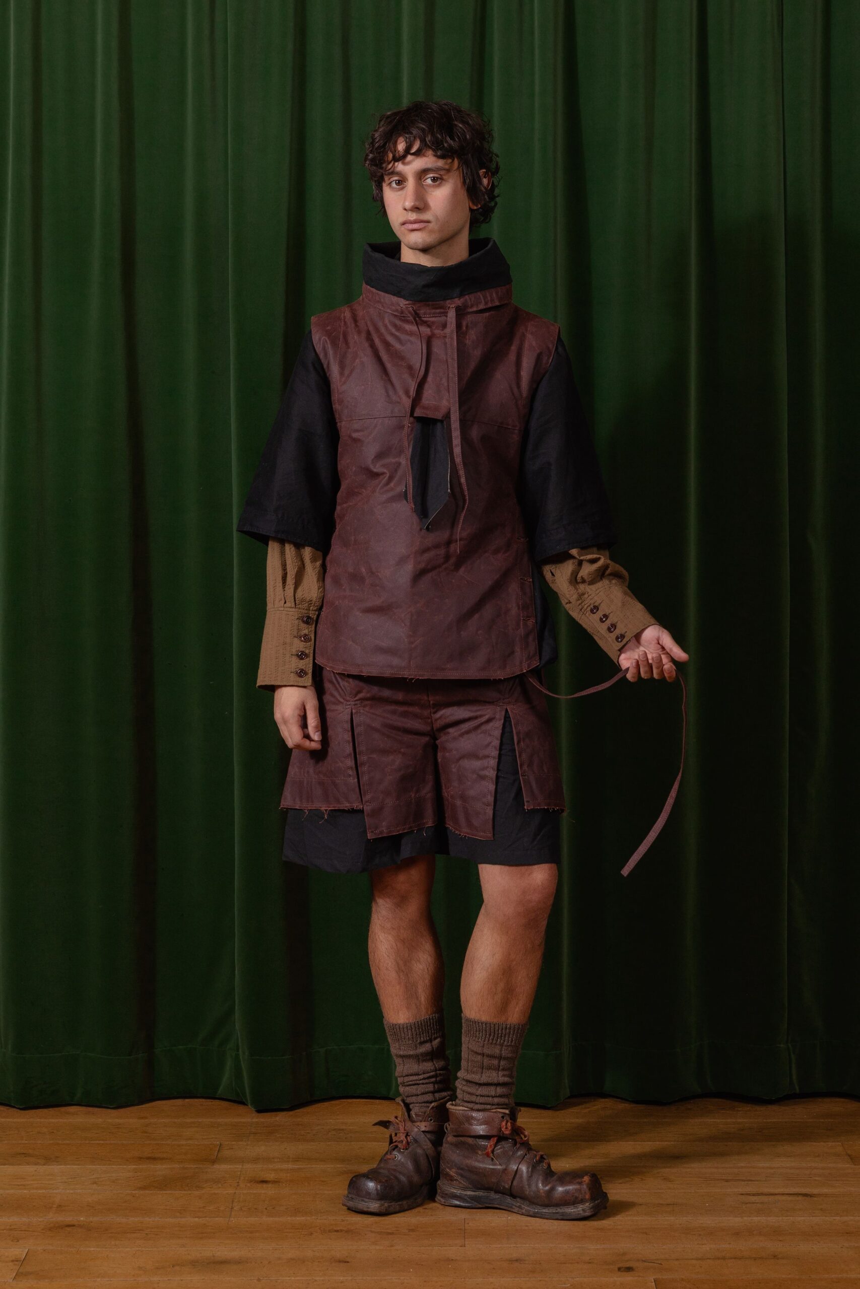 brown leather top with black shorts