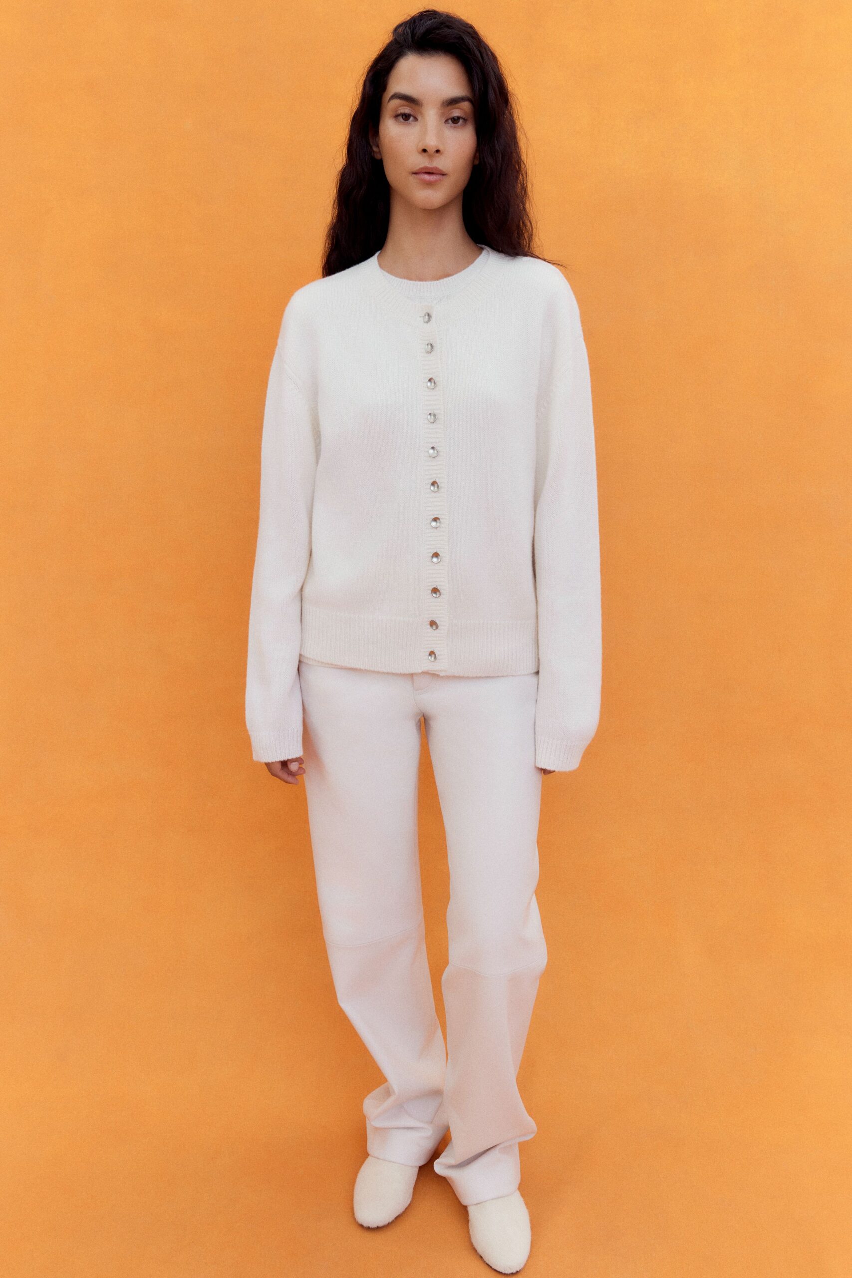 white relaxed sweater with fitted pants