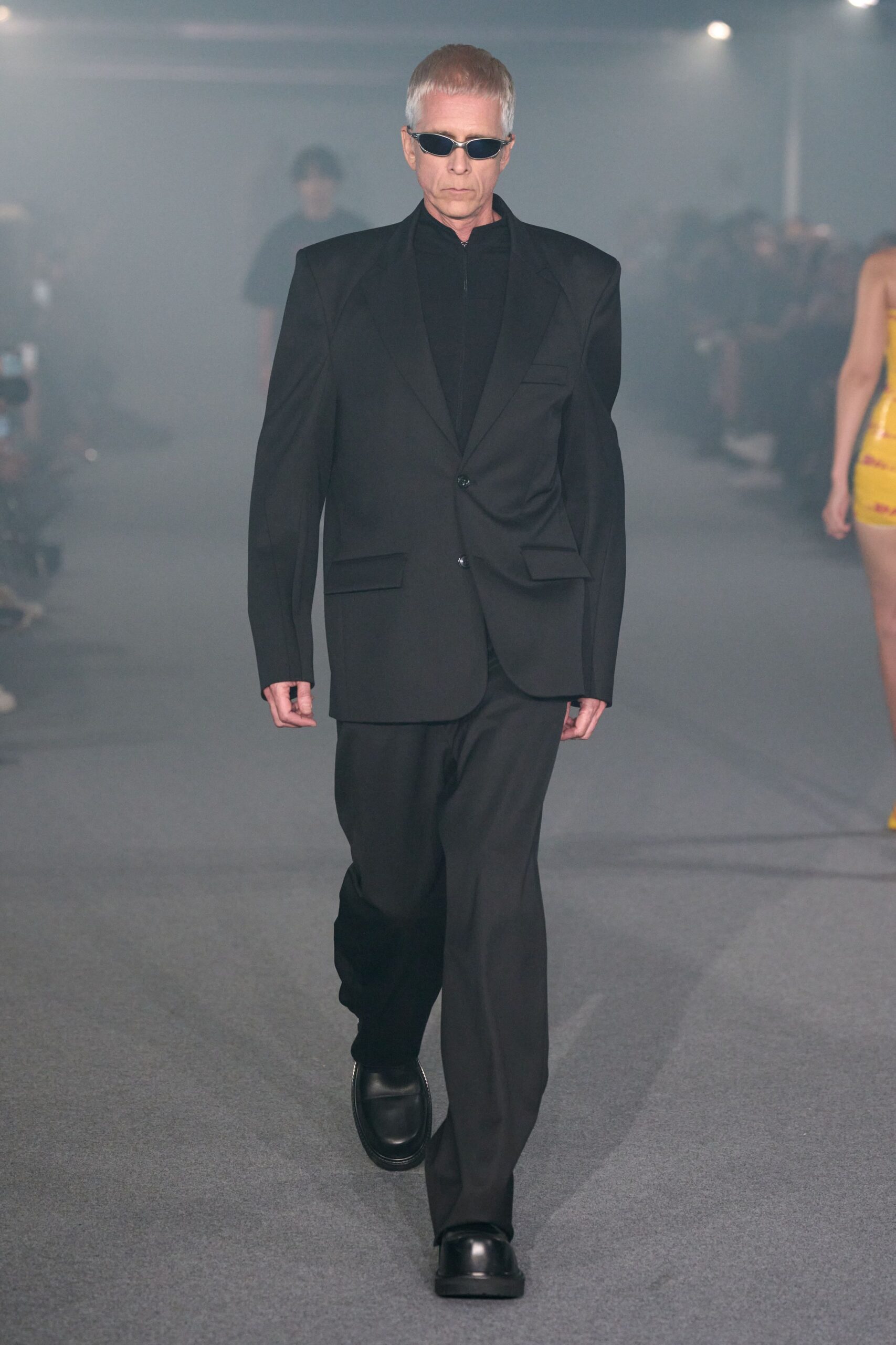 black tailored suit with sunglasses