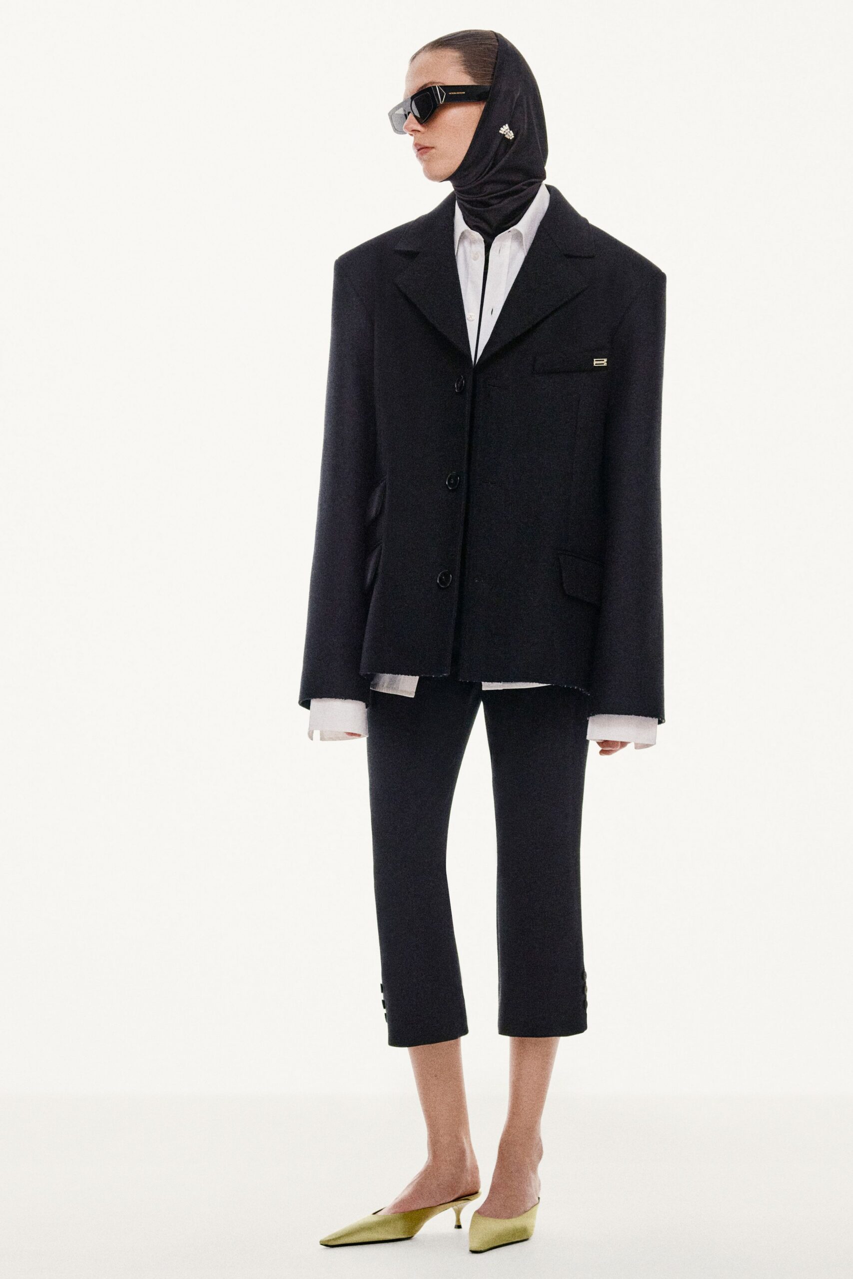 black wool long-sleeve collared oversized buttoned jacket