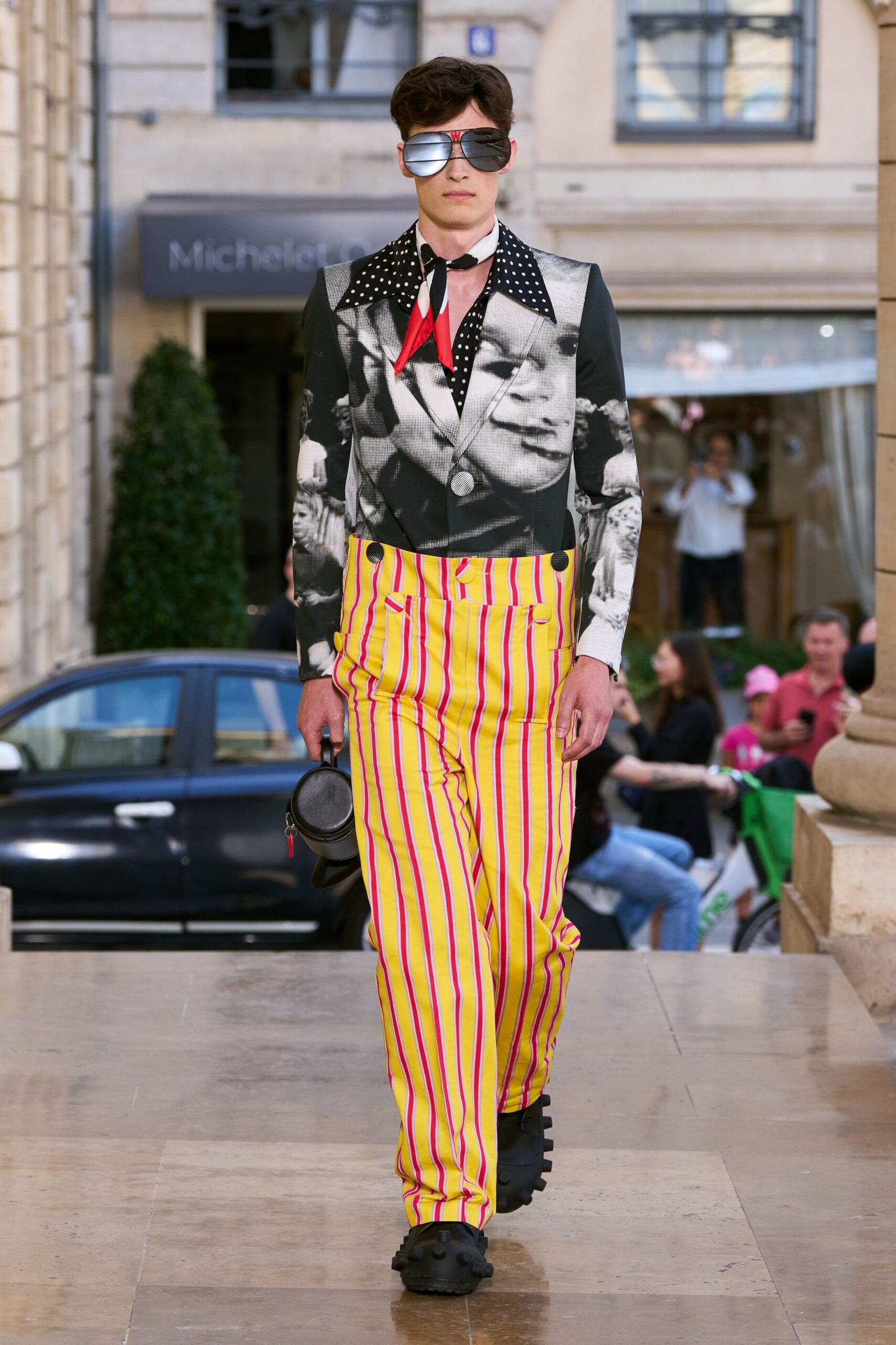 black and white printed shirt with striped pants