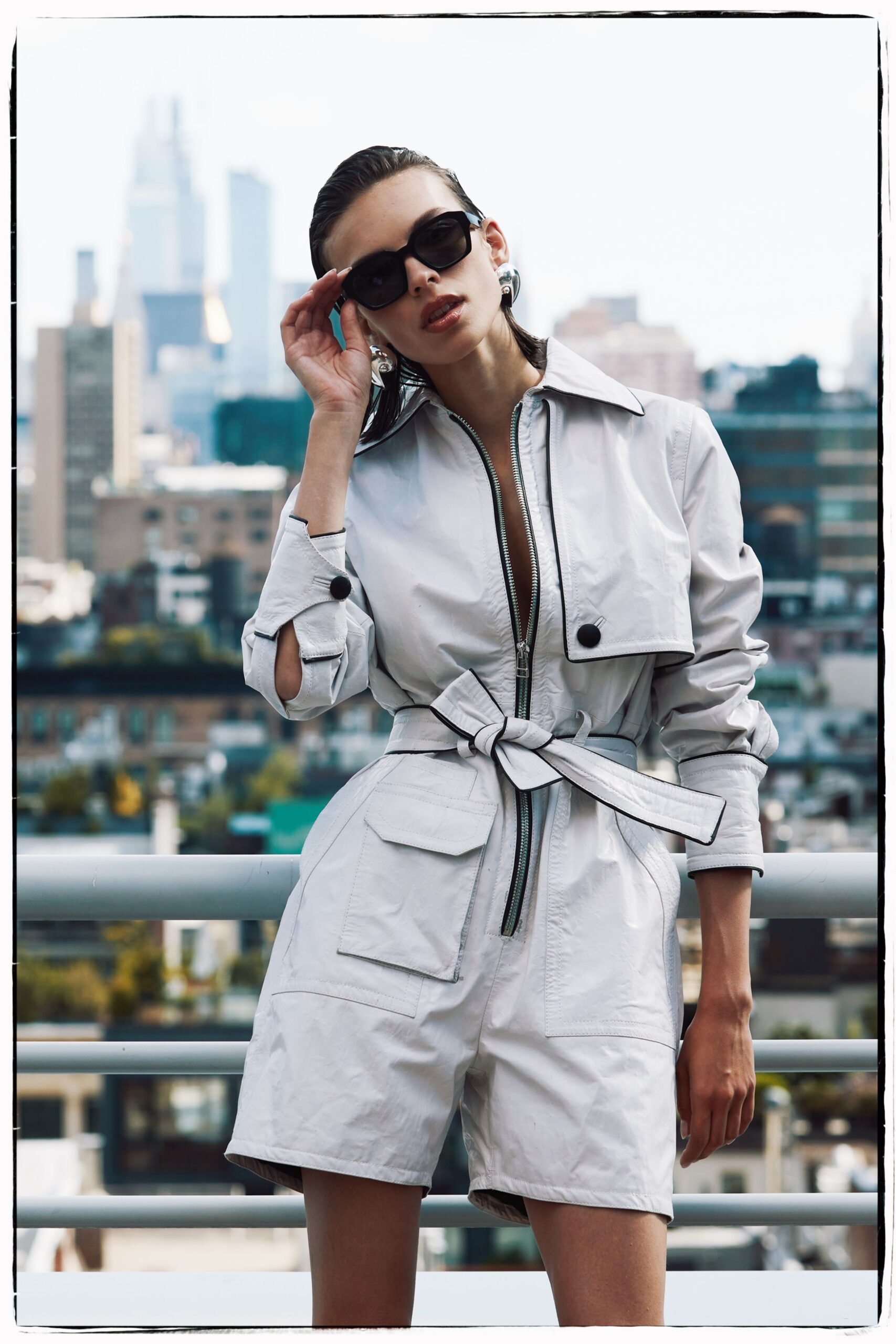 white cotton long-sleeve collared fitted zippered belted jumpsuit