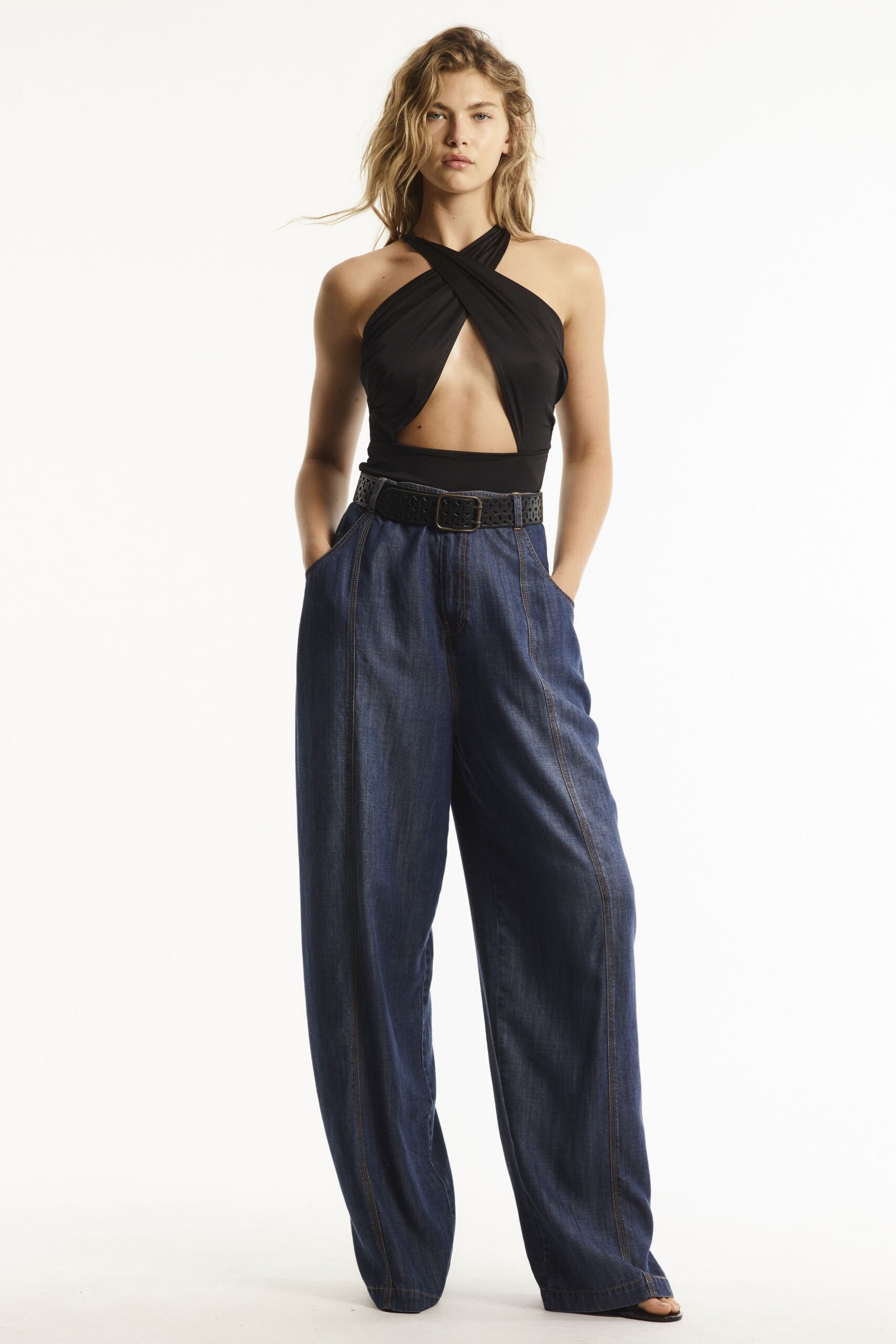 black cutout top with wide-leg jeans