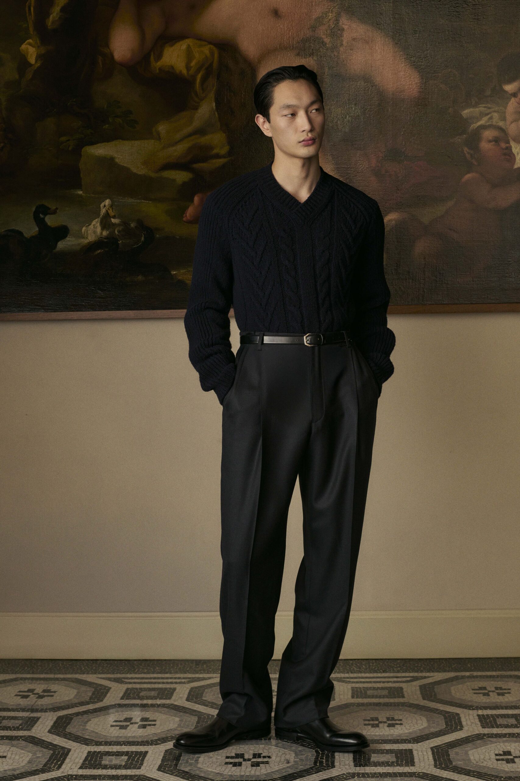 black wool v-neck sweater and tailored pants