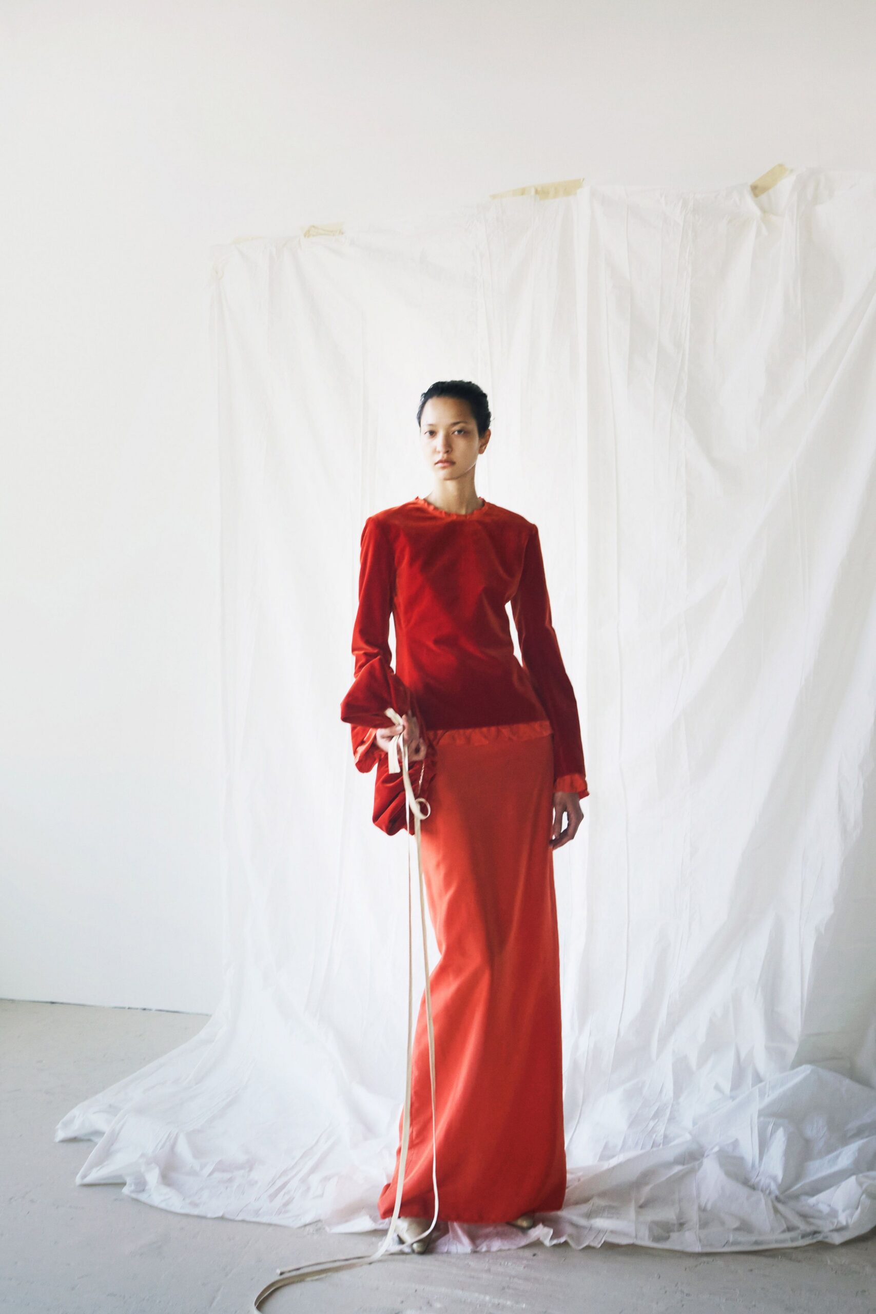 red velvet long-sleeve gown