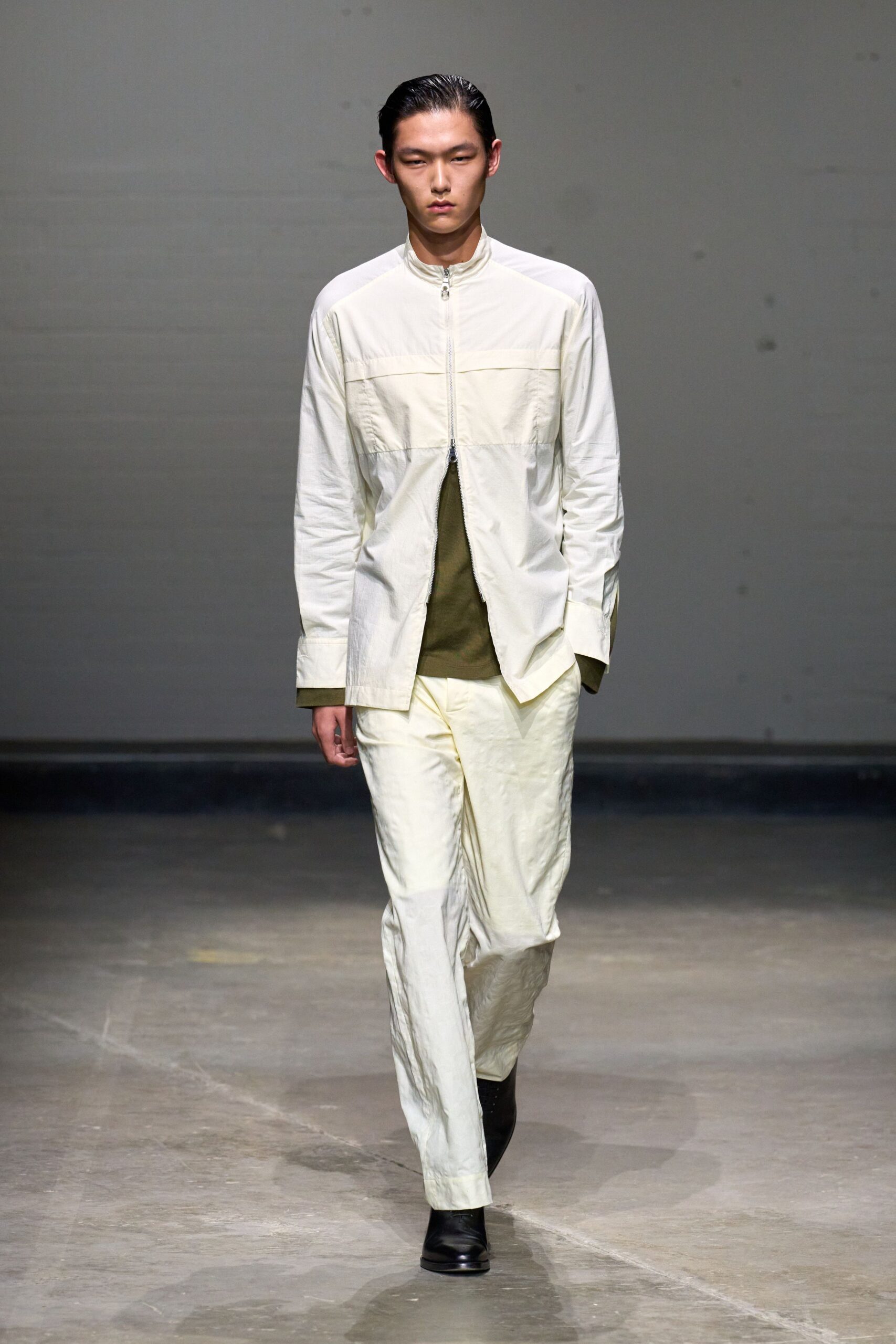 white shirt green top beige pants