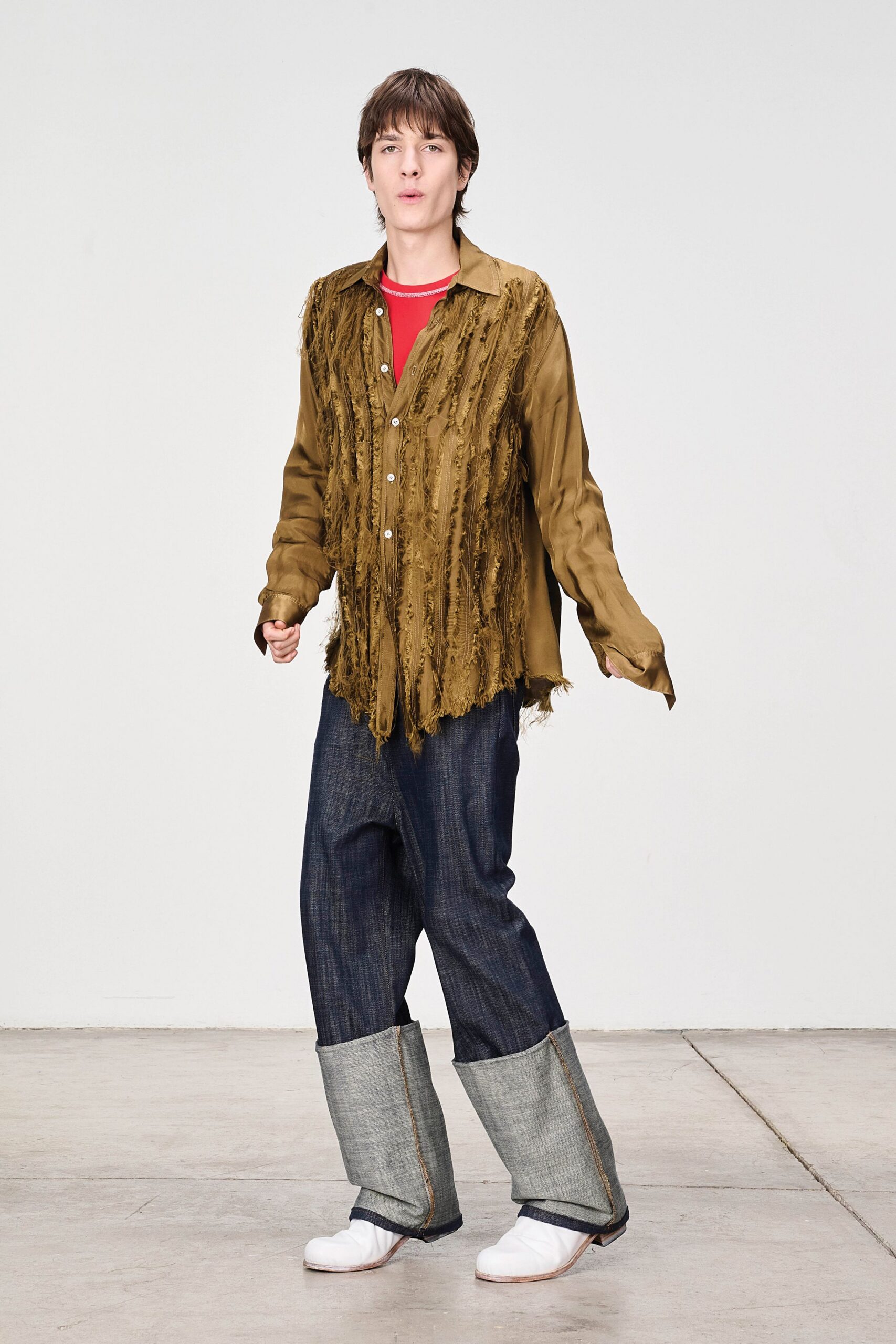 brown fringed shirt with blue pants