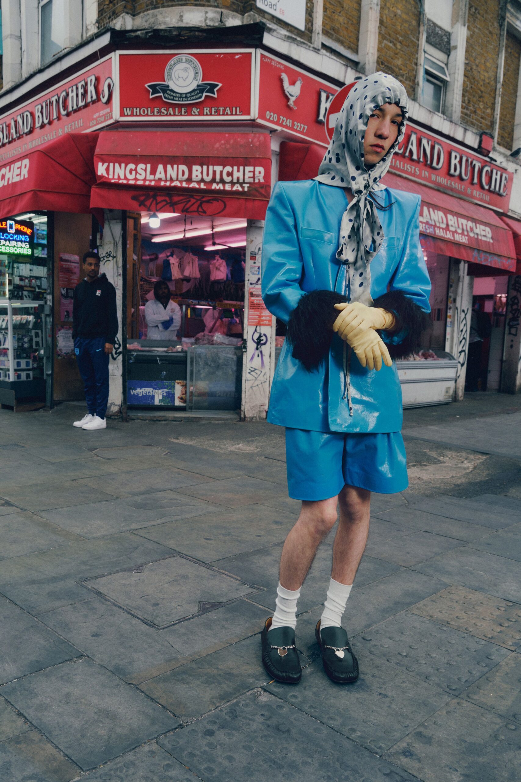 blue blazer with yellow gloves