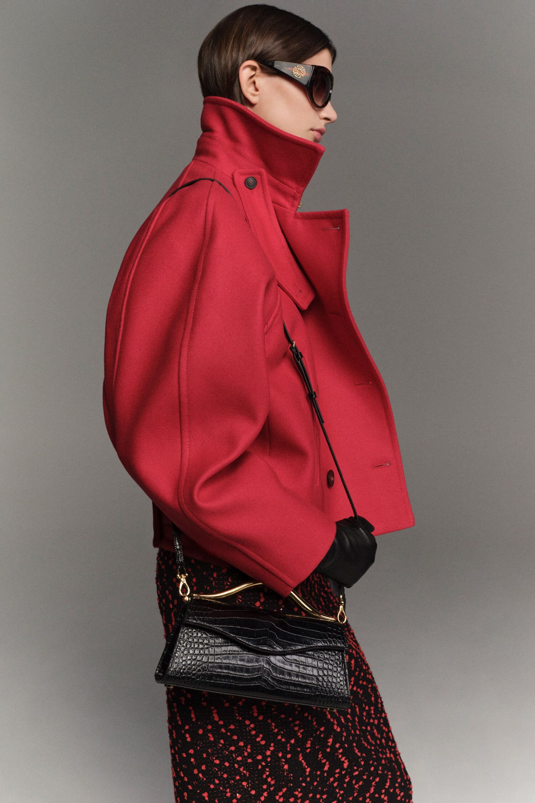 red wool long-sleeve collared oversized zippered buttoned coat