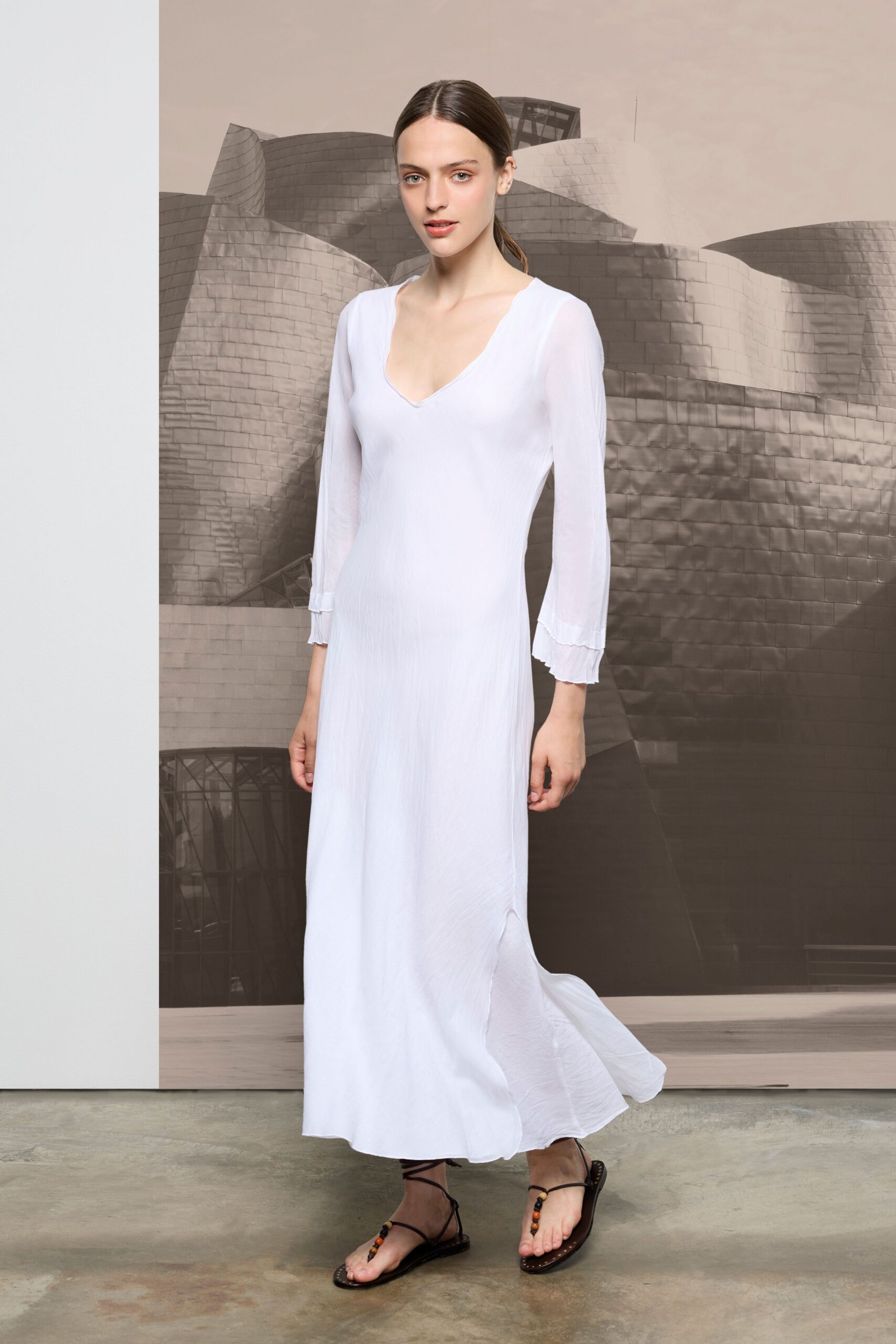 white chiffon long-sleeve v-neck fitted flowing maxi dress