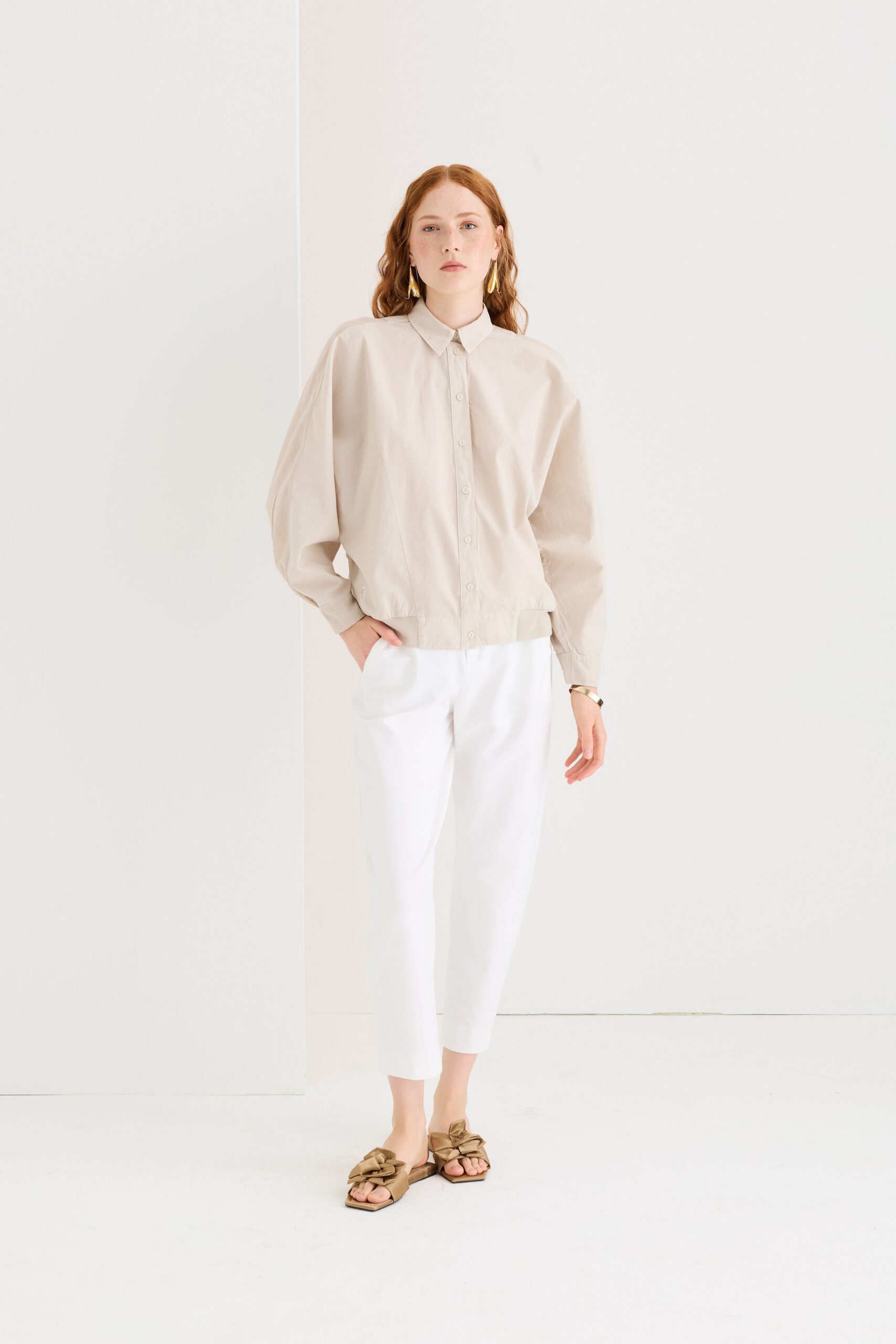 beige shirt white pants brown sandals