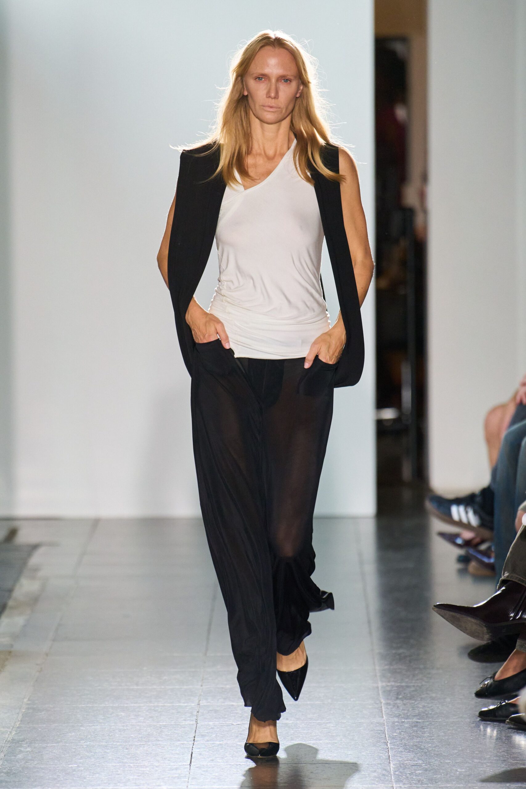black vest white top sheer pants