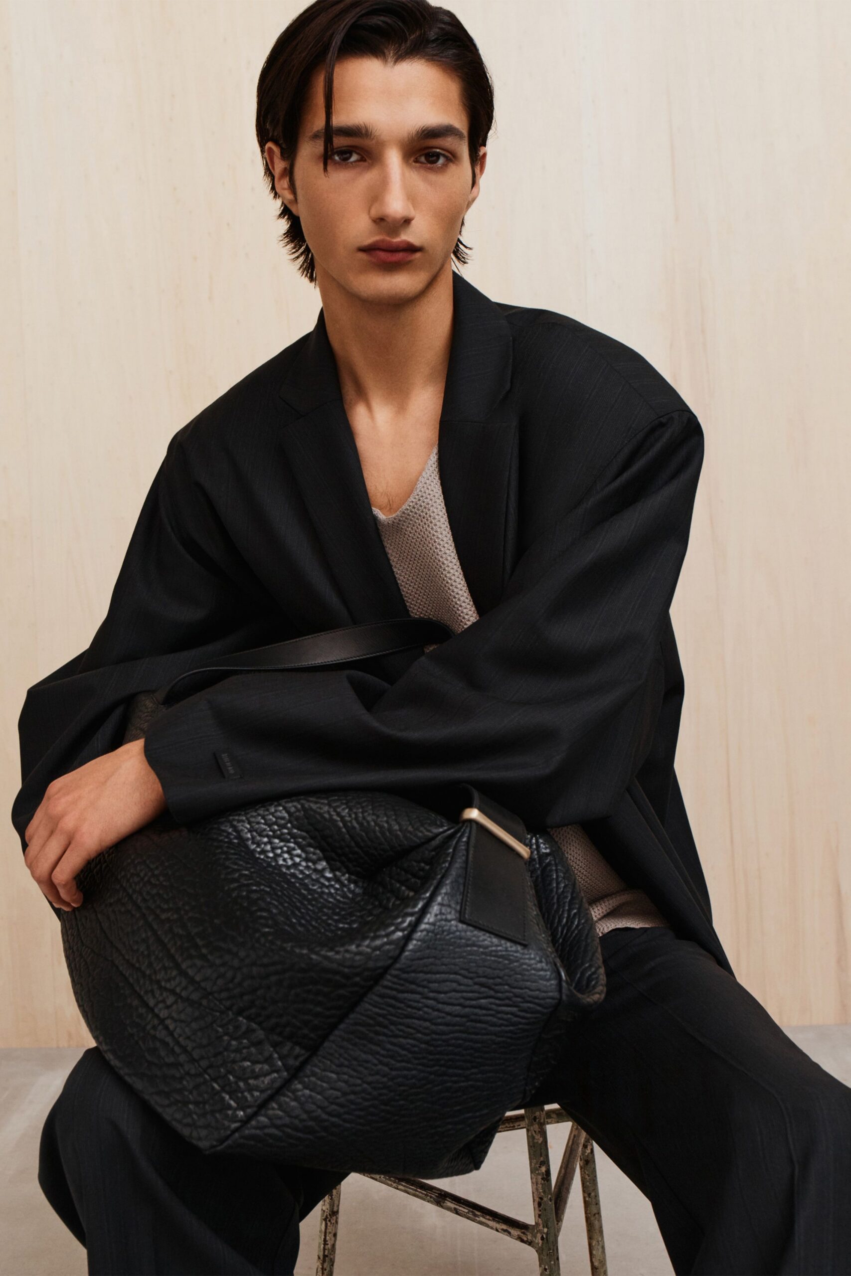 black blazer beige top black pants