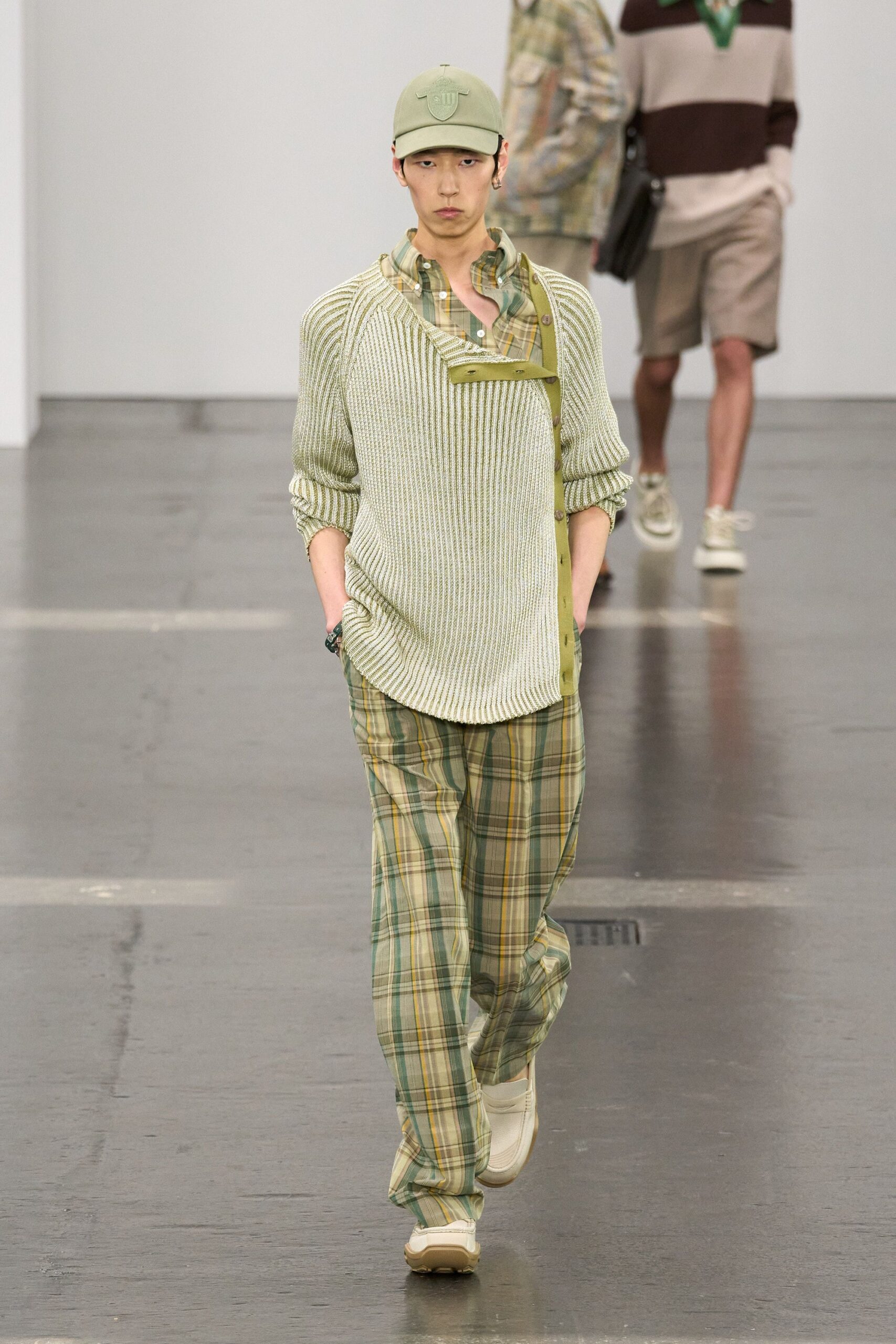 green striped shirt and checked pants