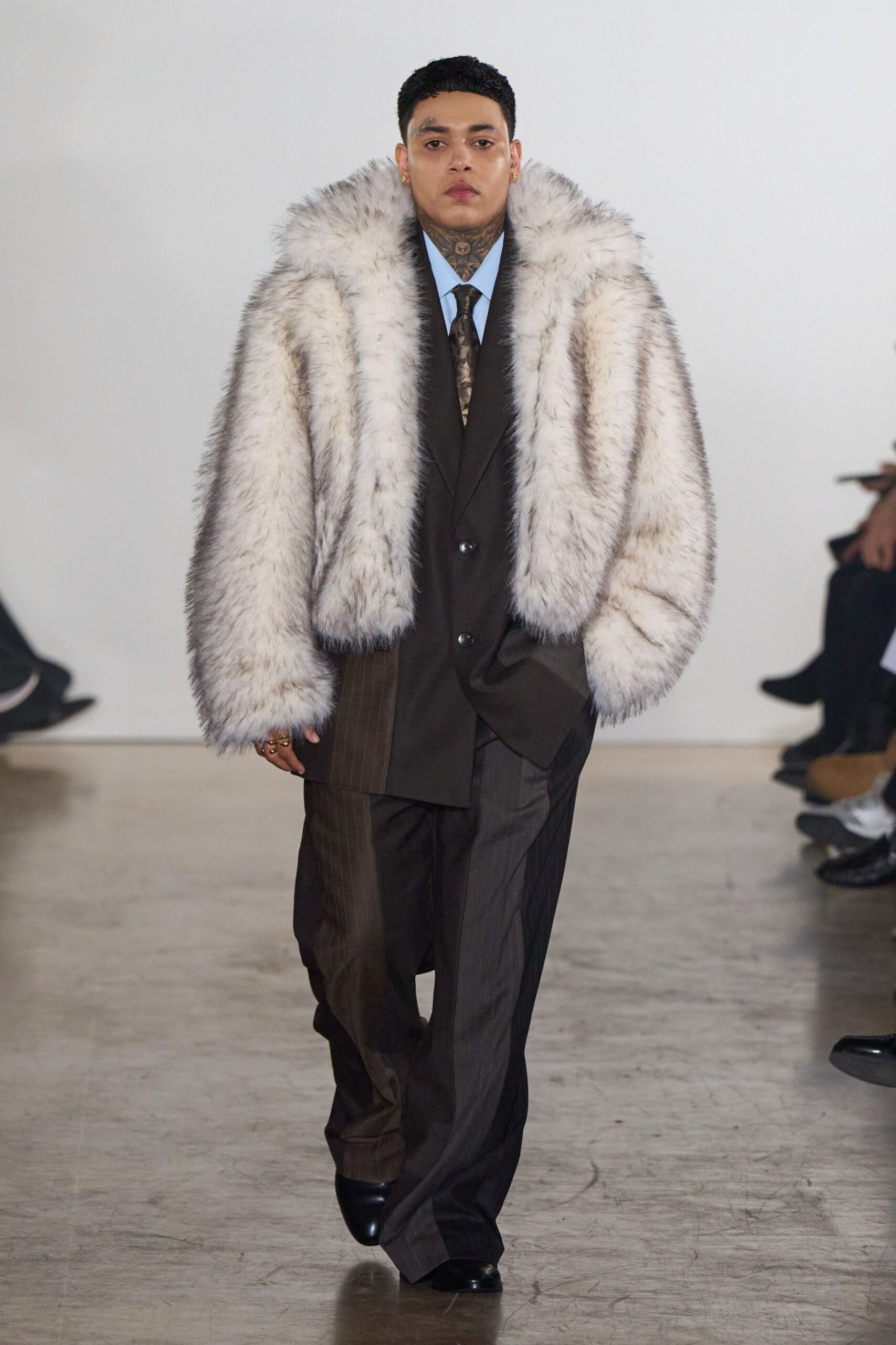 white fur oversized coat with brown suit