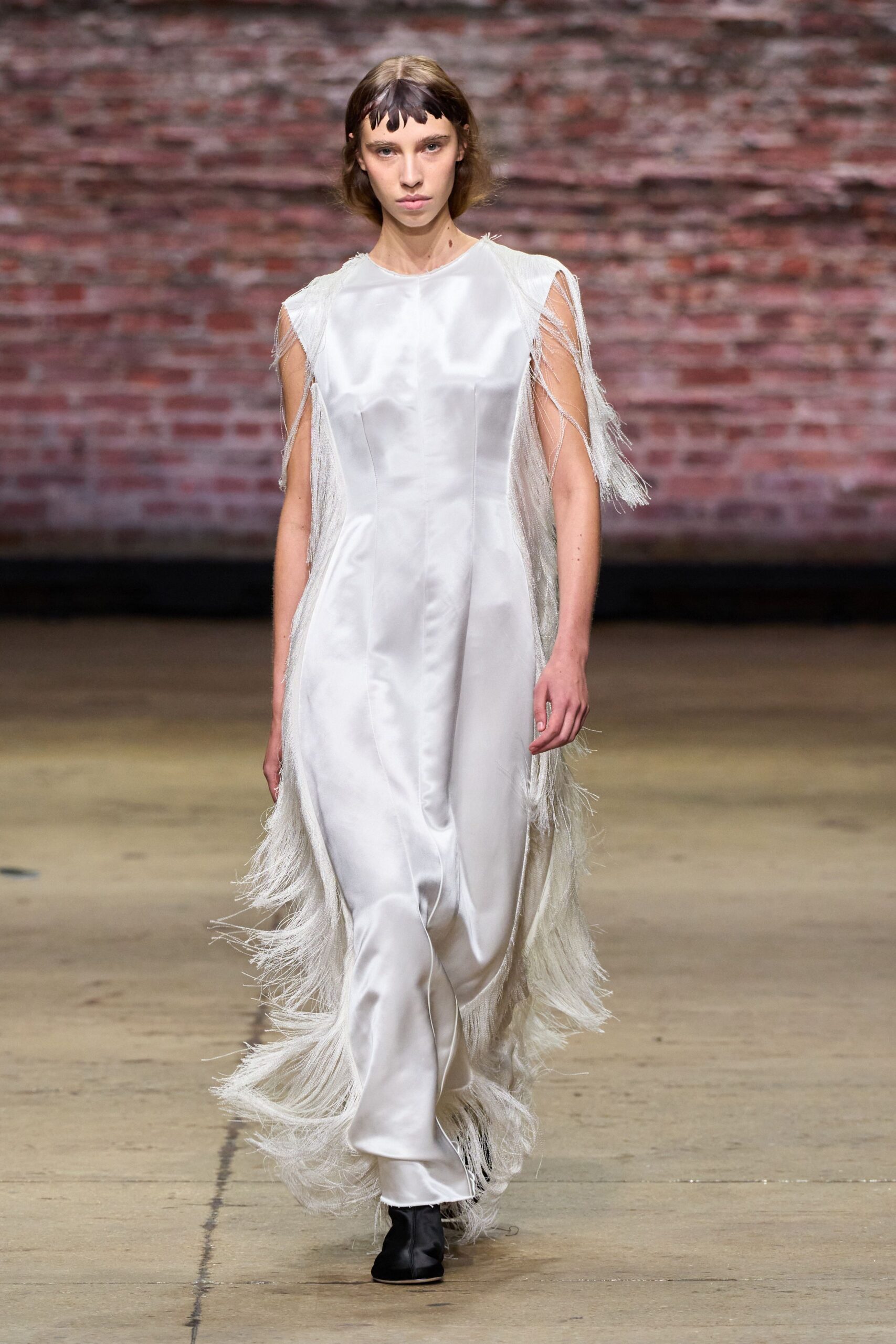 white silk fringed gown with black boots