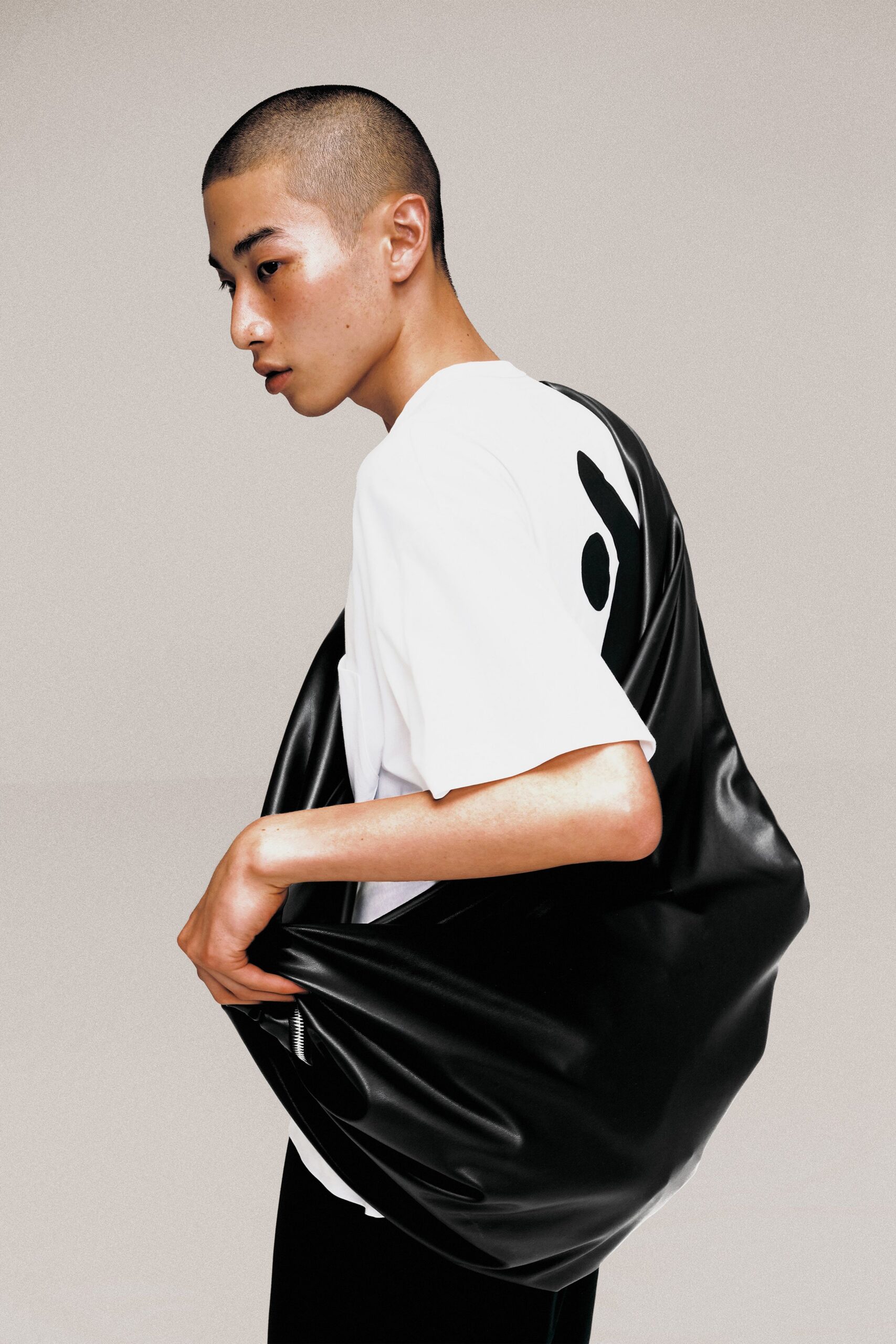 white relaxed t-shirt with black bag